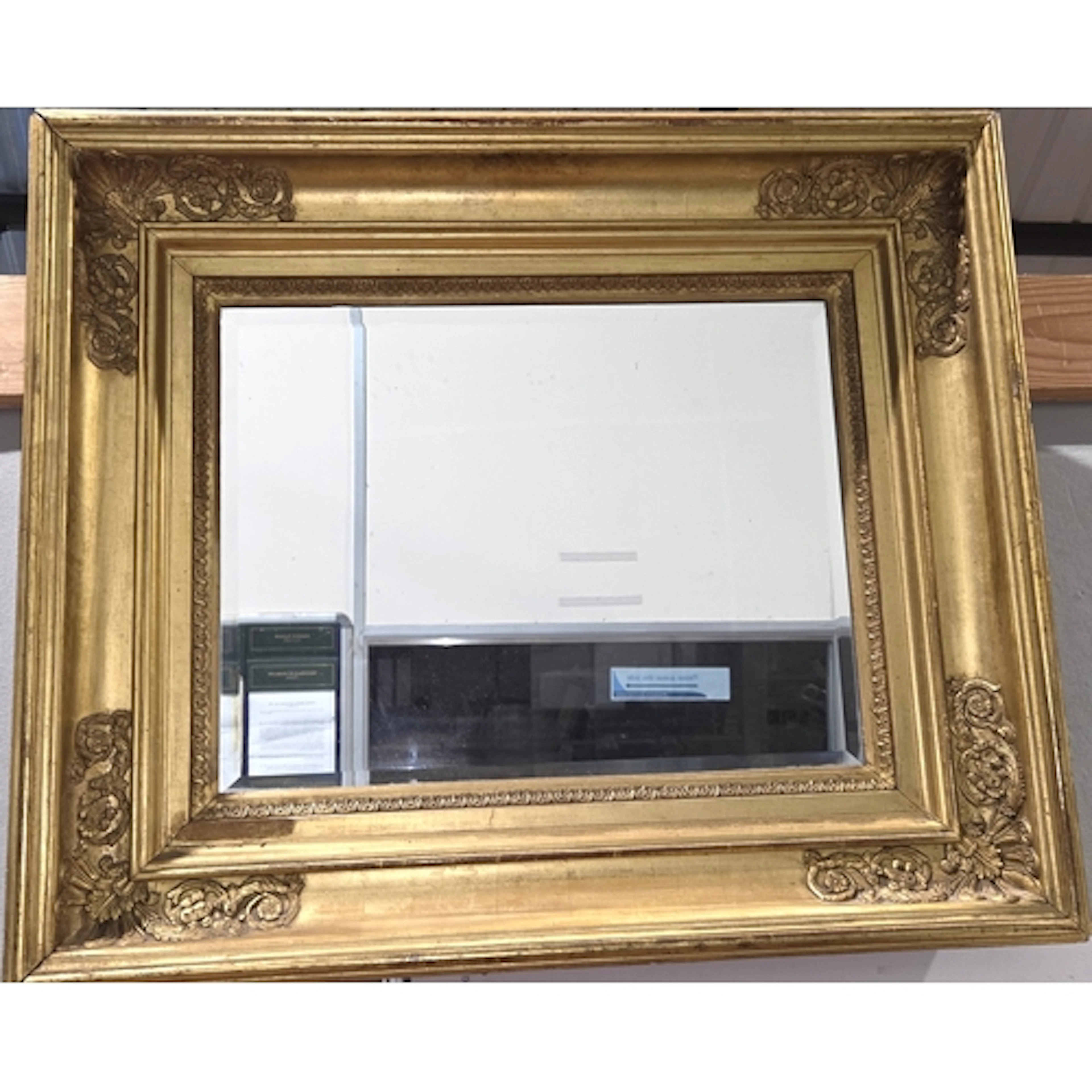 A Victorian bevelled glass rectangular mirror in ornate deep...