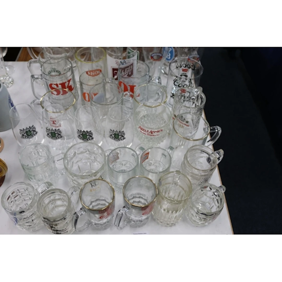 Branded glass beer mugs and tankards.