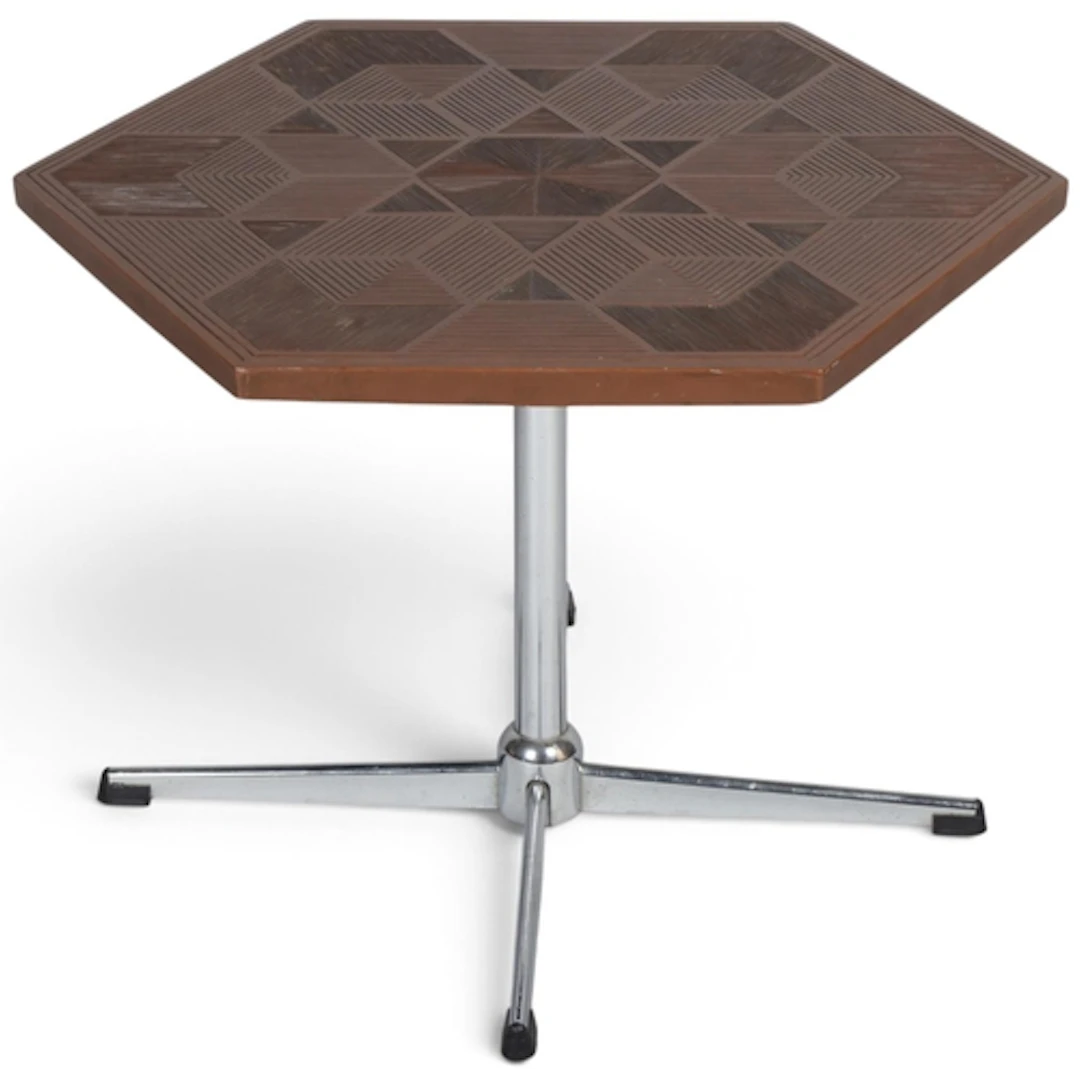 A vintage hexagonal side table with geometric carved pattern...