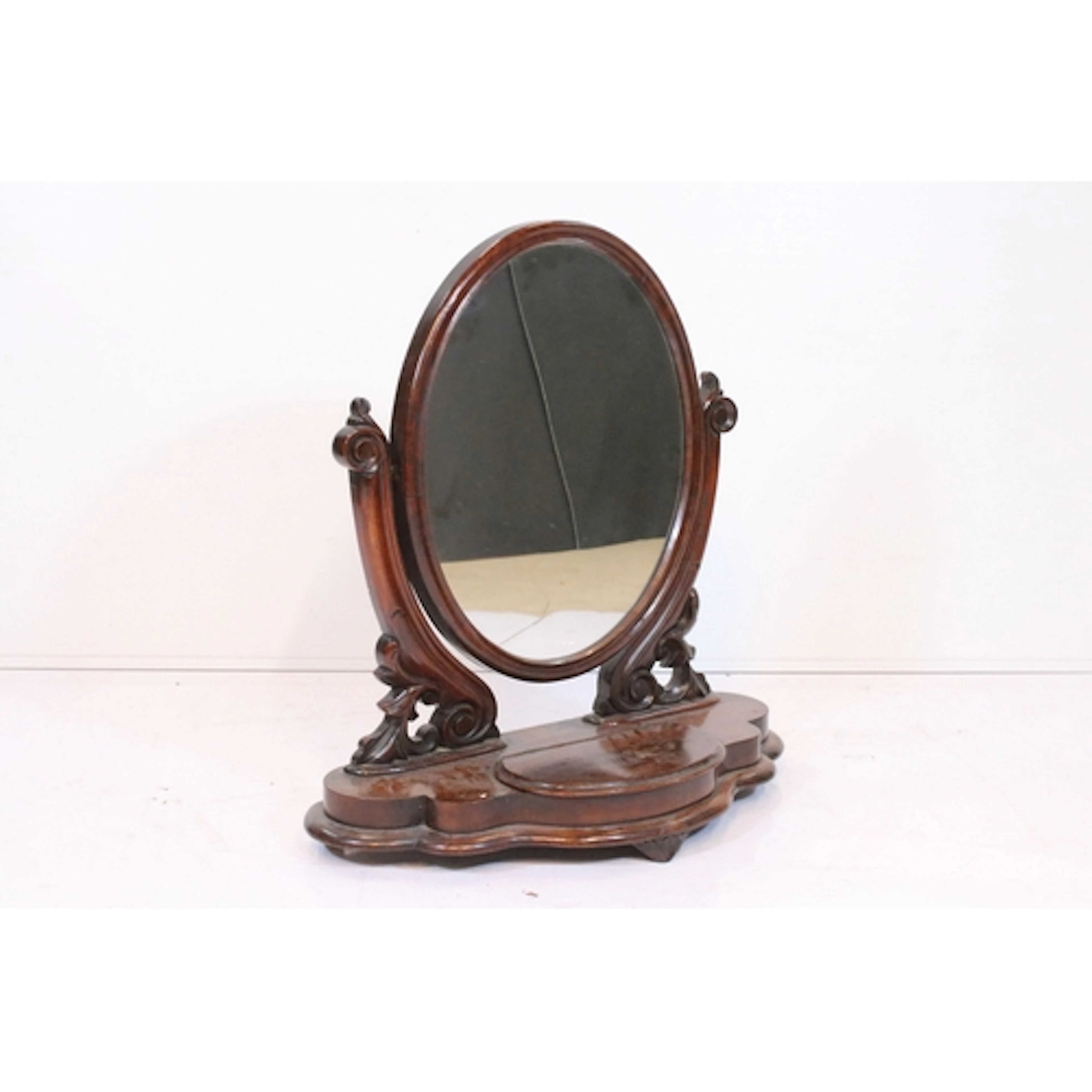Victorian mahogany toilet mirror, having oval plate on scrol...