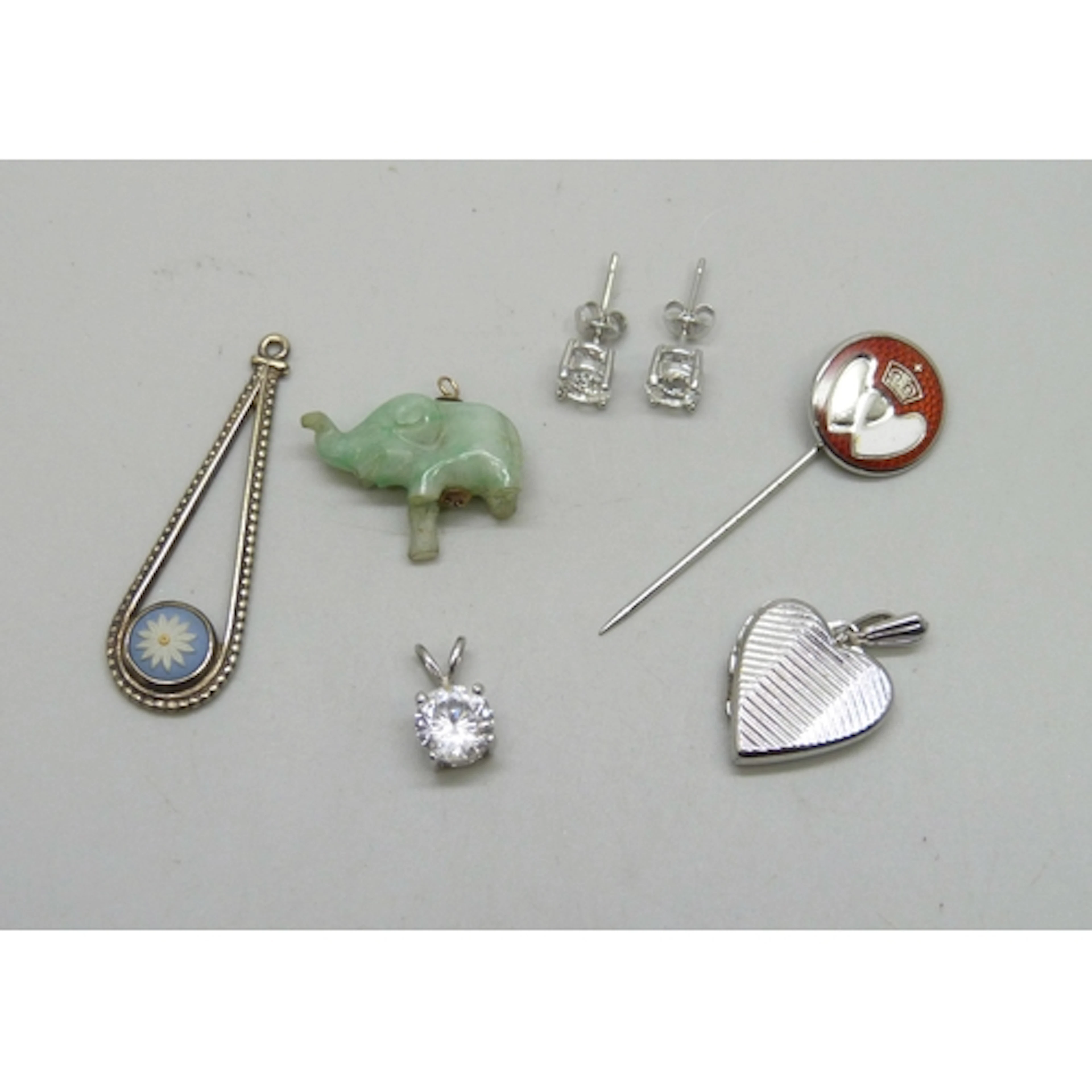 A silver heart locket, a silver and Wedgwood Jasperware pend...