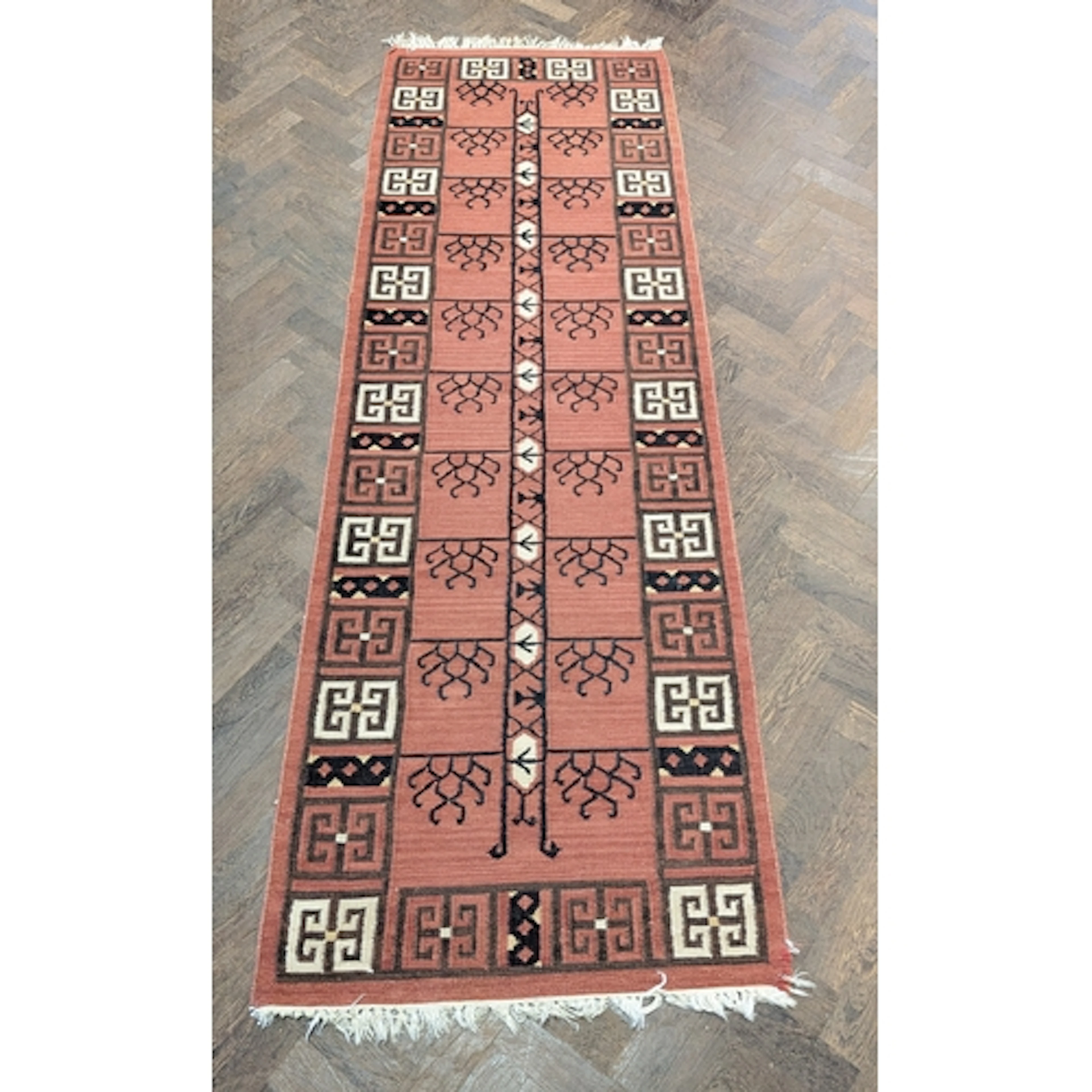 A rust and geometric design Kilim carpet runner, 8' x 2'9"