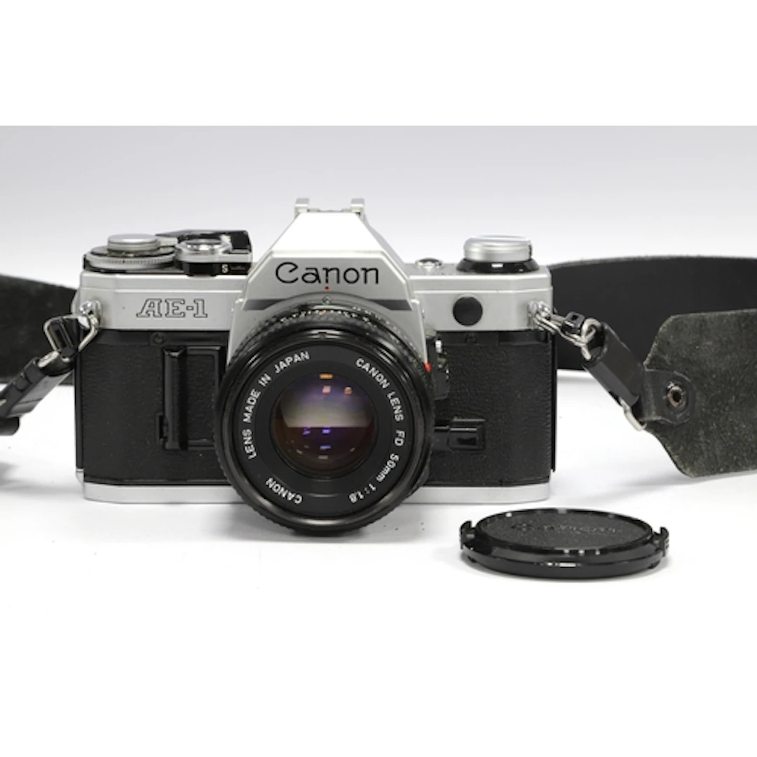 Canon AE-1 35mm SLR Film Camera with attached Canon FD 50mm ...