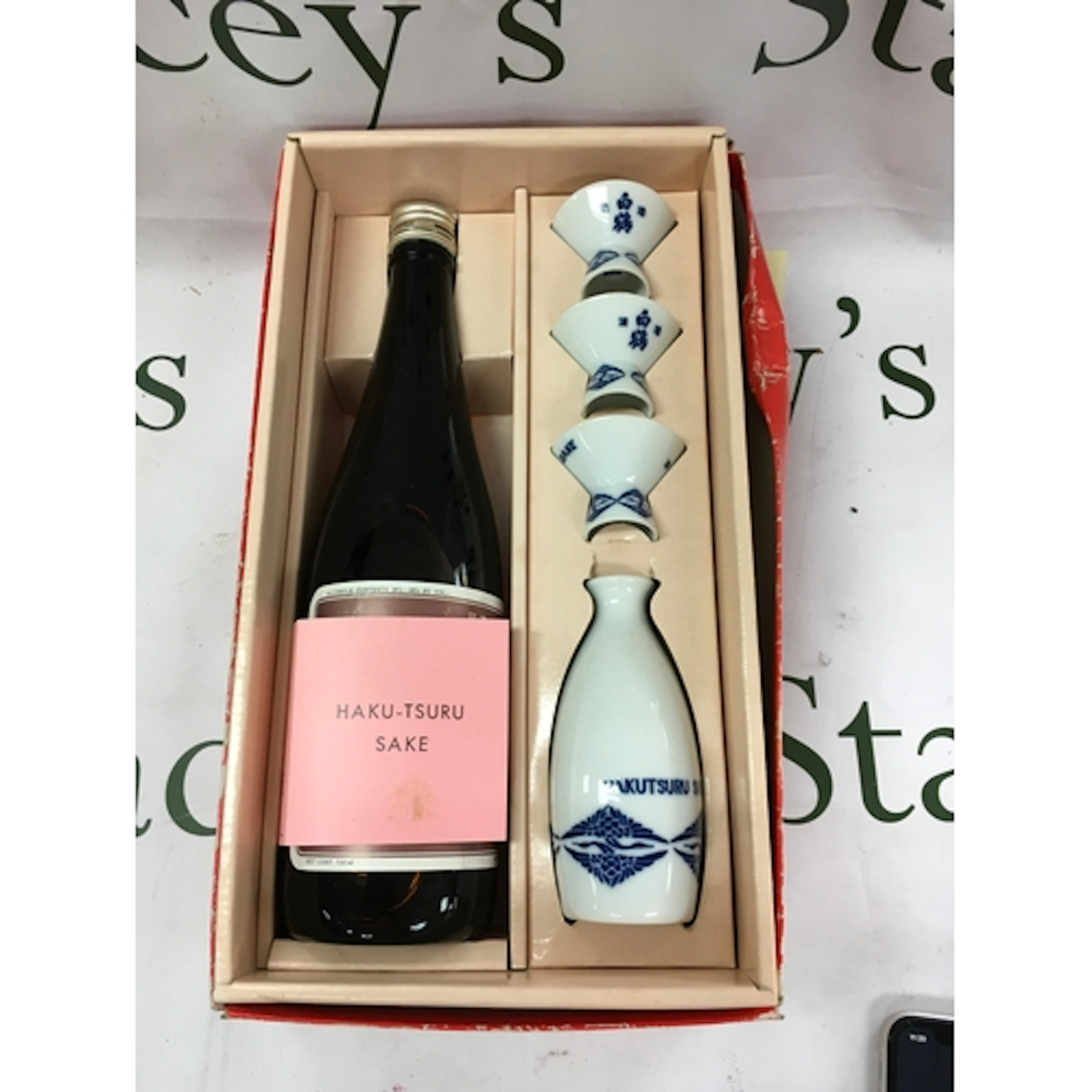 A Hakutsuru brand sake gift set featuring a 720ml bottle and...