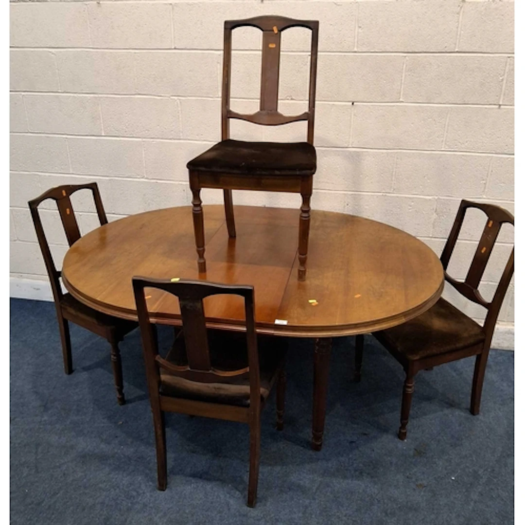 AN EXTENDING DINING TABLE, with a single fold out leaf, rais...