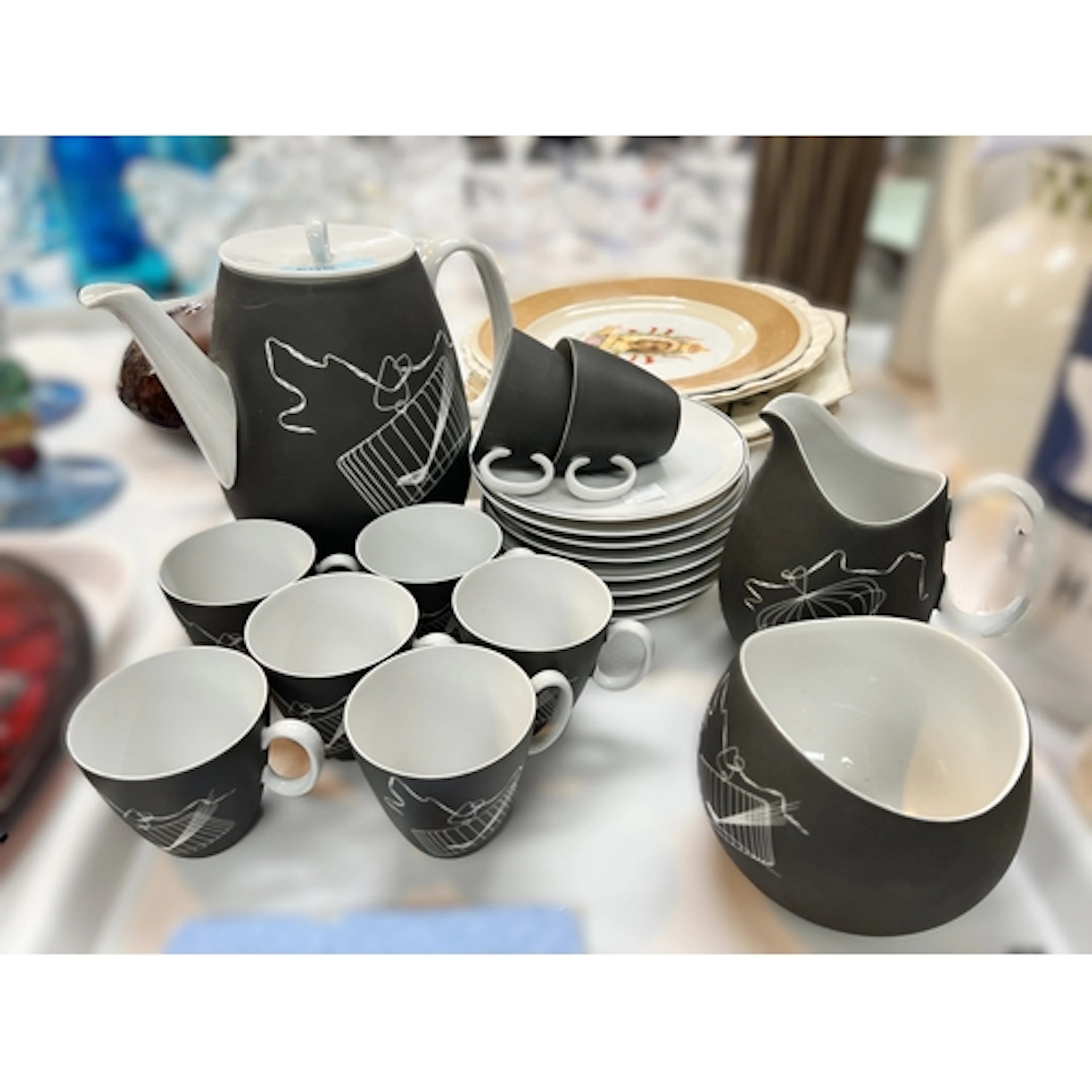 A mid 20th century 19 piece, 8 setting coffee service "Papag...
