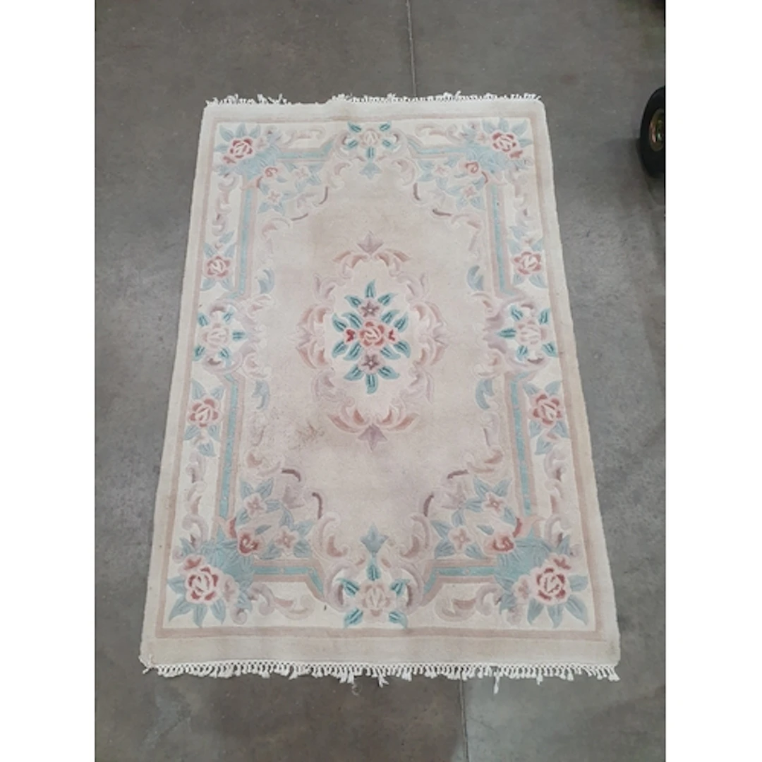 A Chinese style Rug on beige ground with floral border and c...
