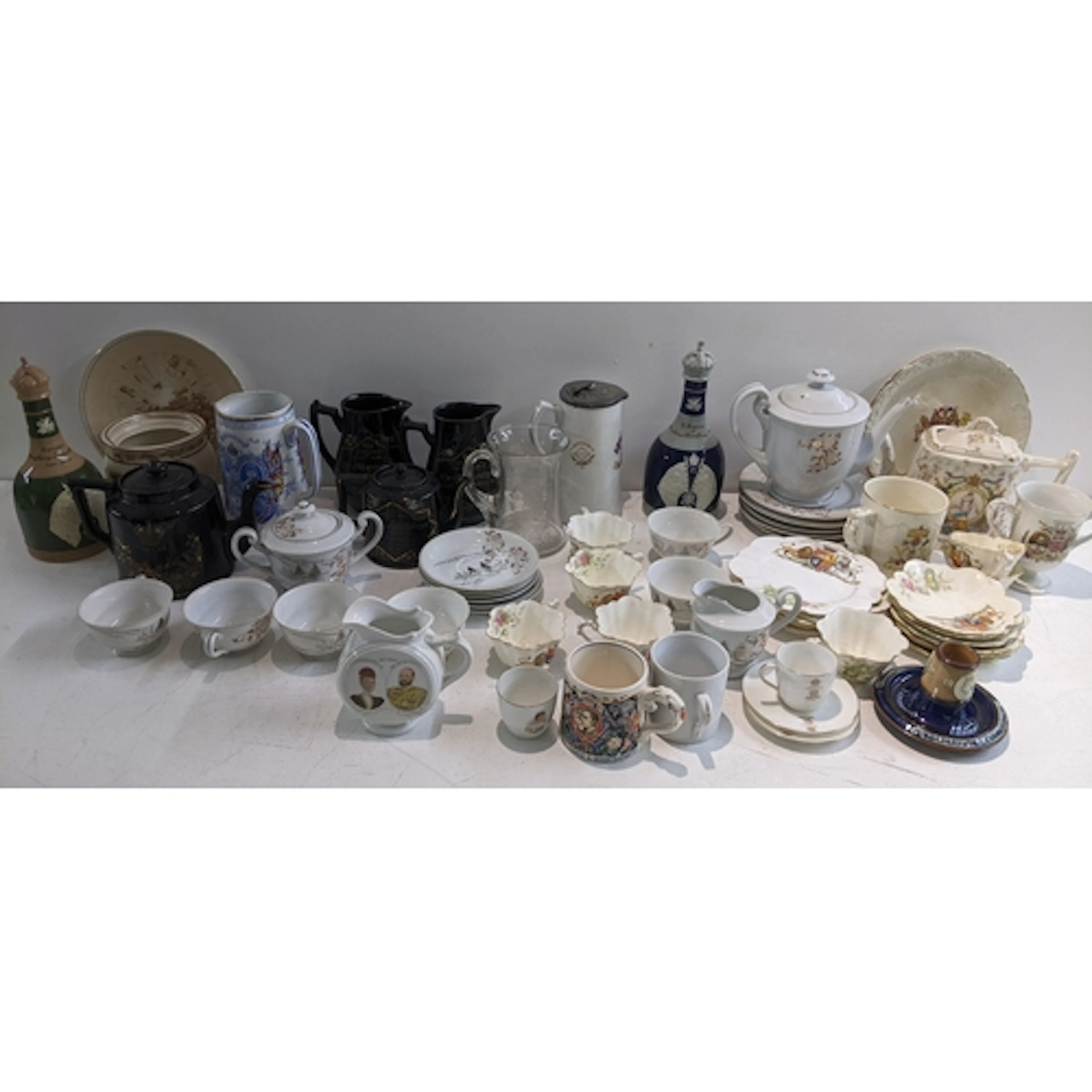 A mixed lot of commemorative items to include a German silve...