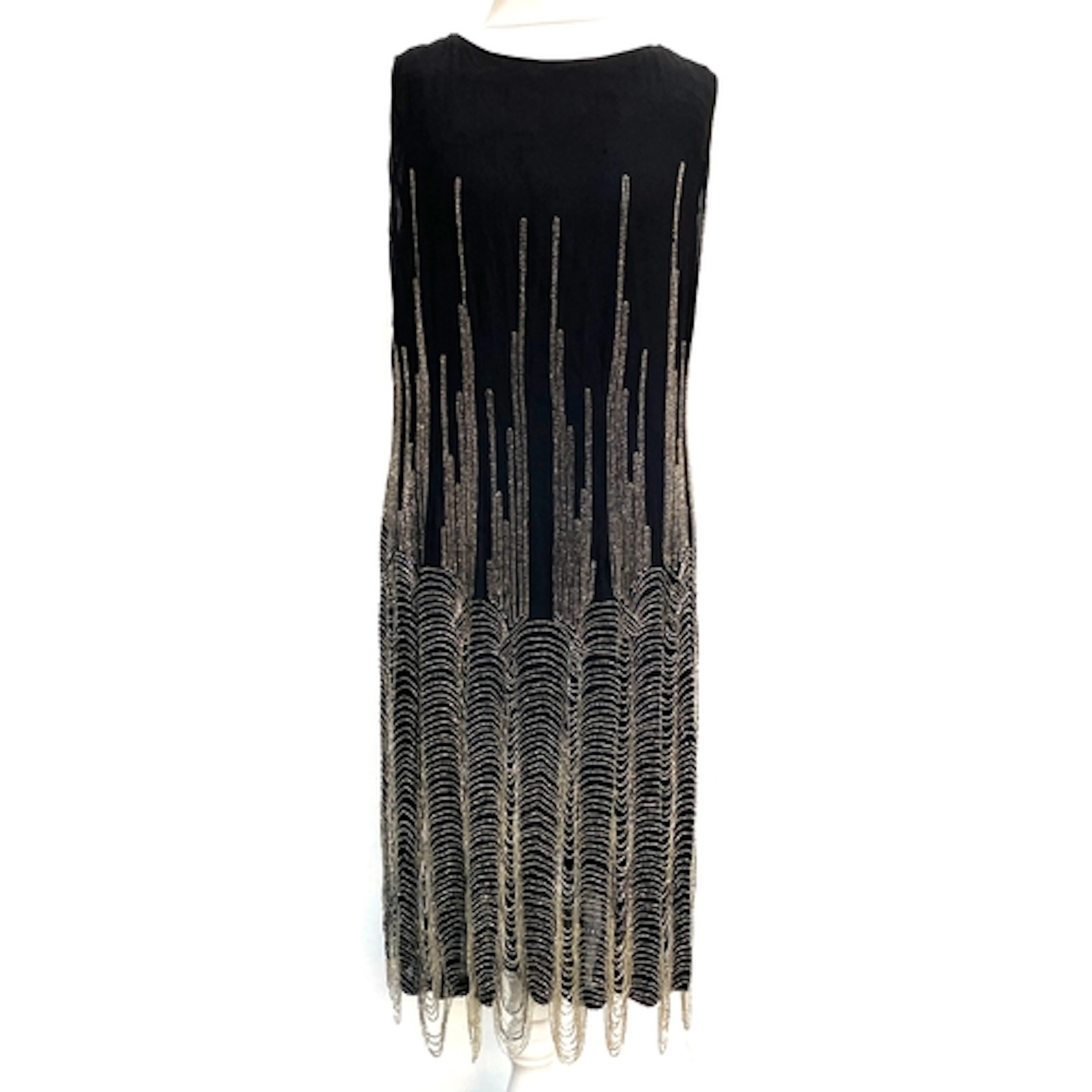 An Early 20th century 1920s flapper style heavily beaded bla...