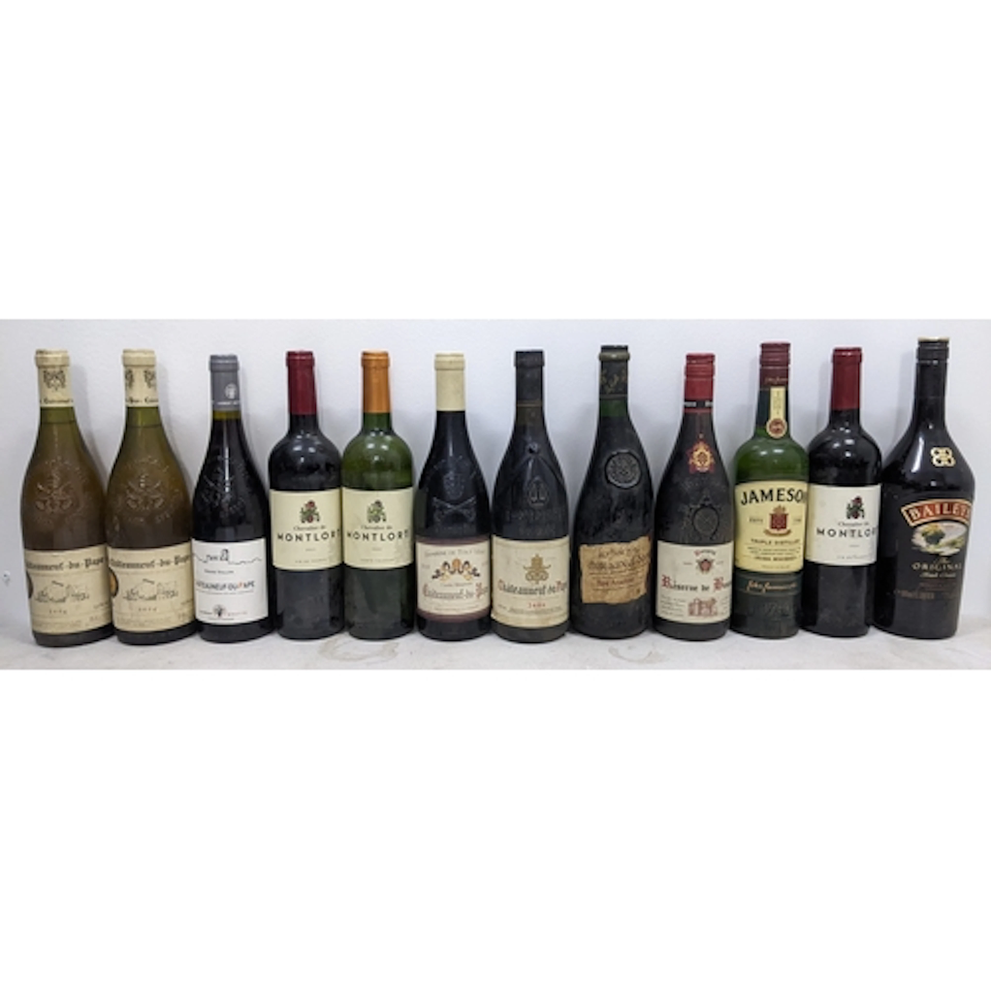 A mixed group of twelve bottles of wine and spirits, compris...