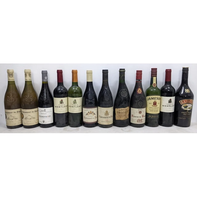 A mixed group of twelve bottles of wine and spirits, compris...