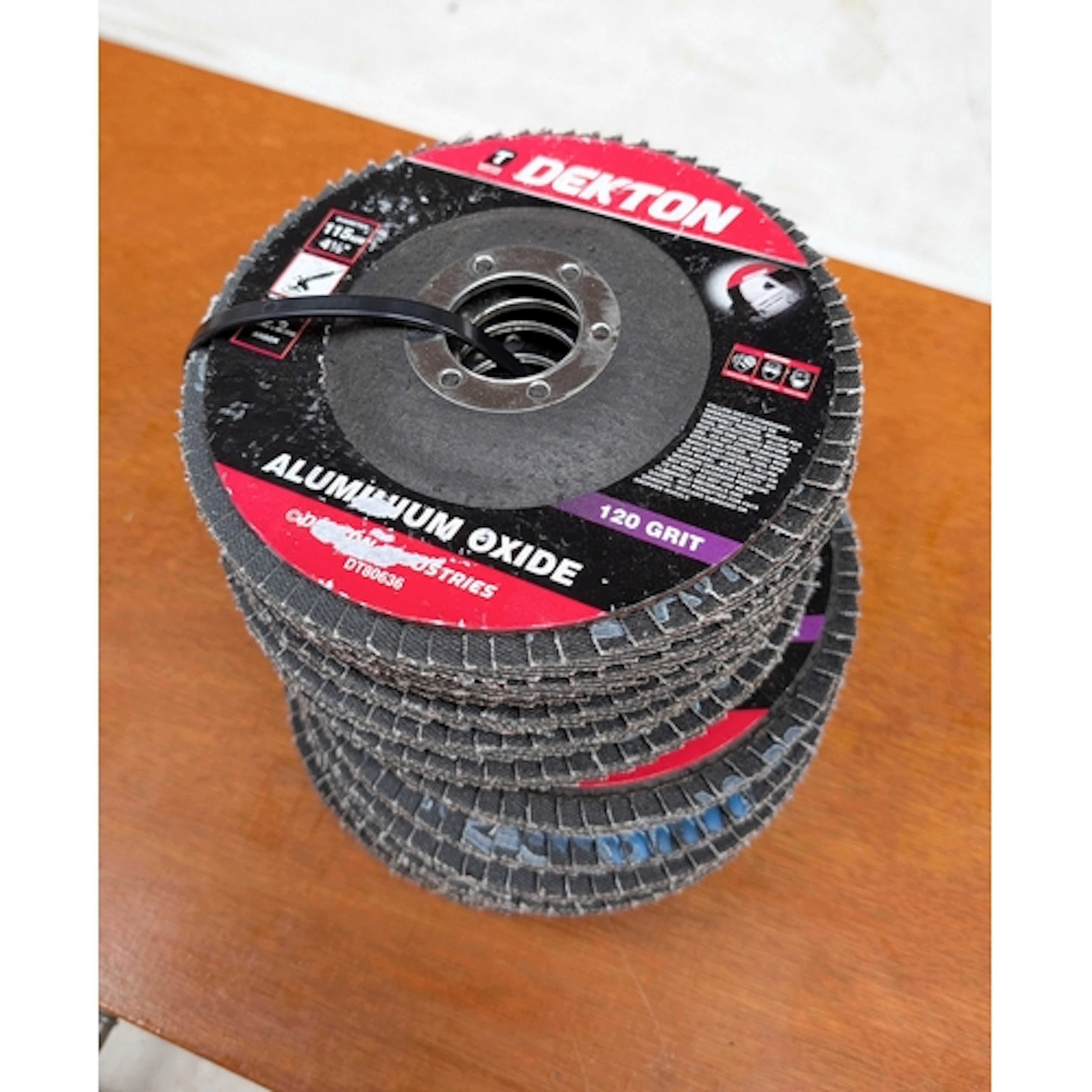 Twelve aluminium oxide 120 grit flap discs