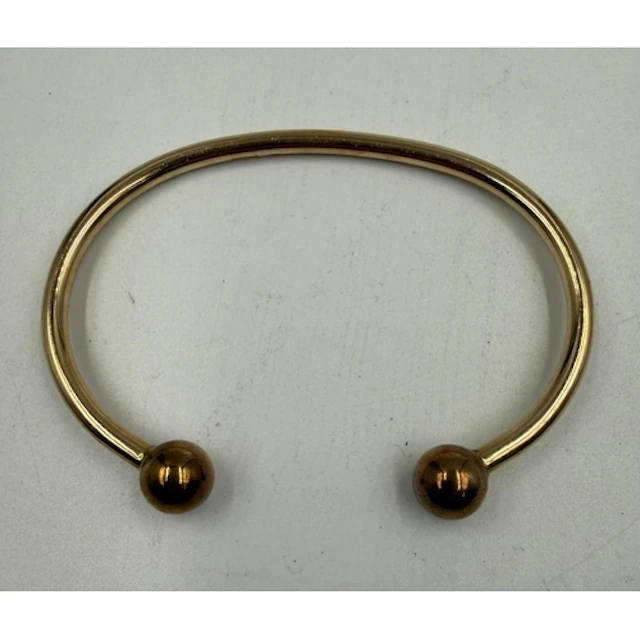 A 9ct yellow gold torque bangle. Approximate total weight 24...