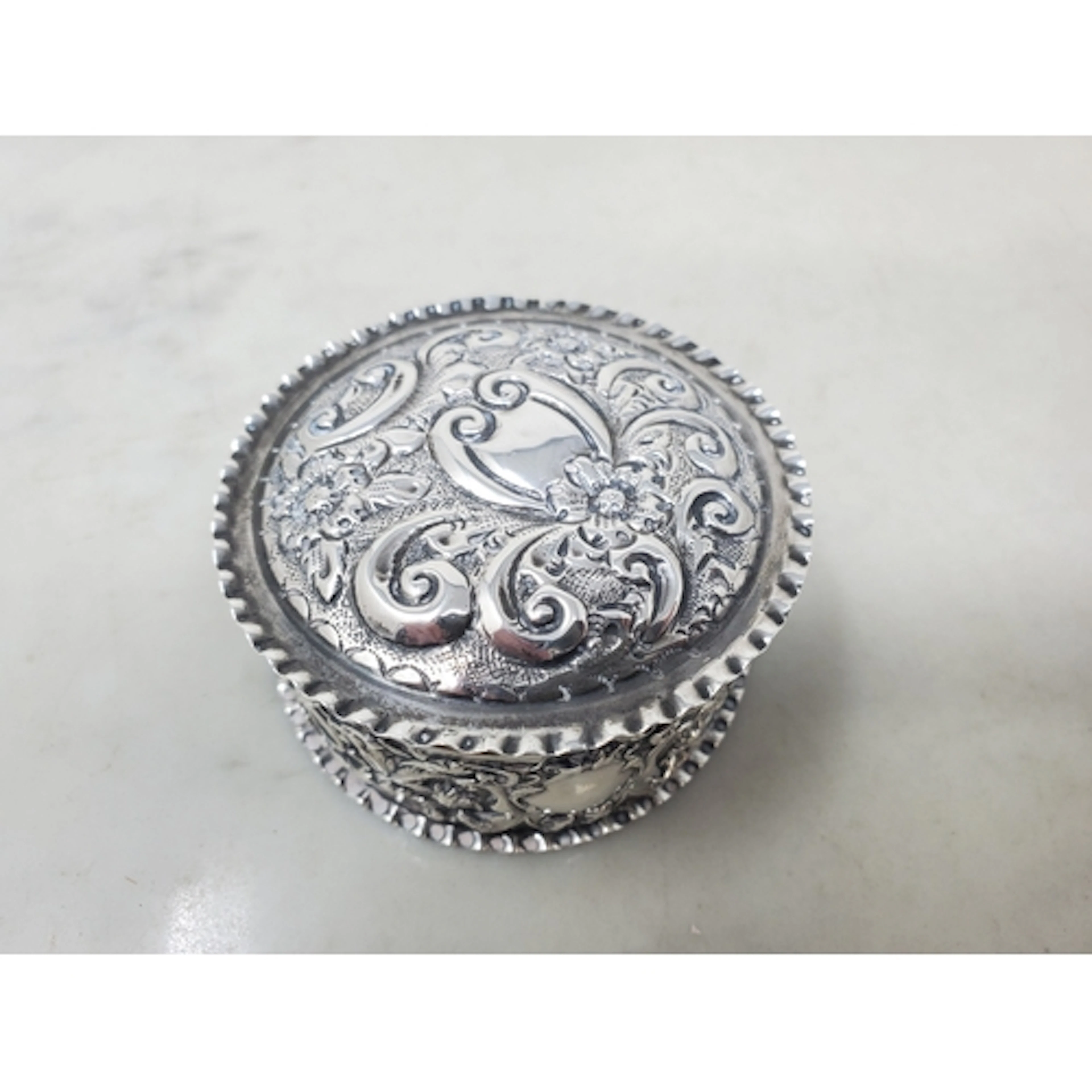 A Victorian silver circular Trinket Box floral and leafage s...