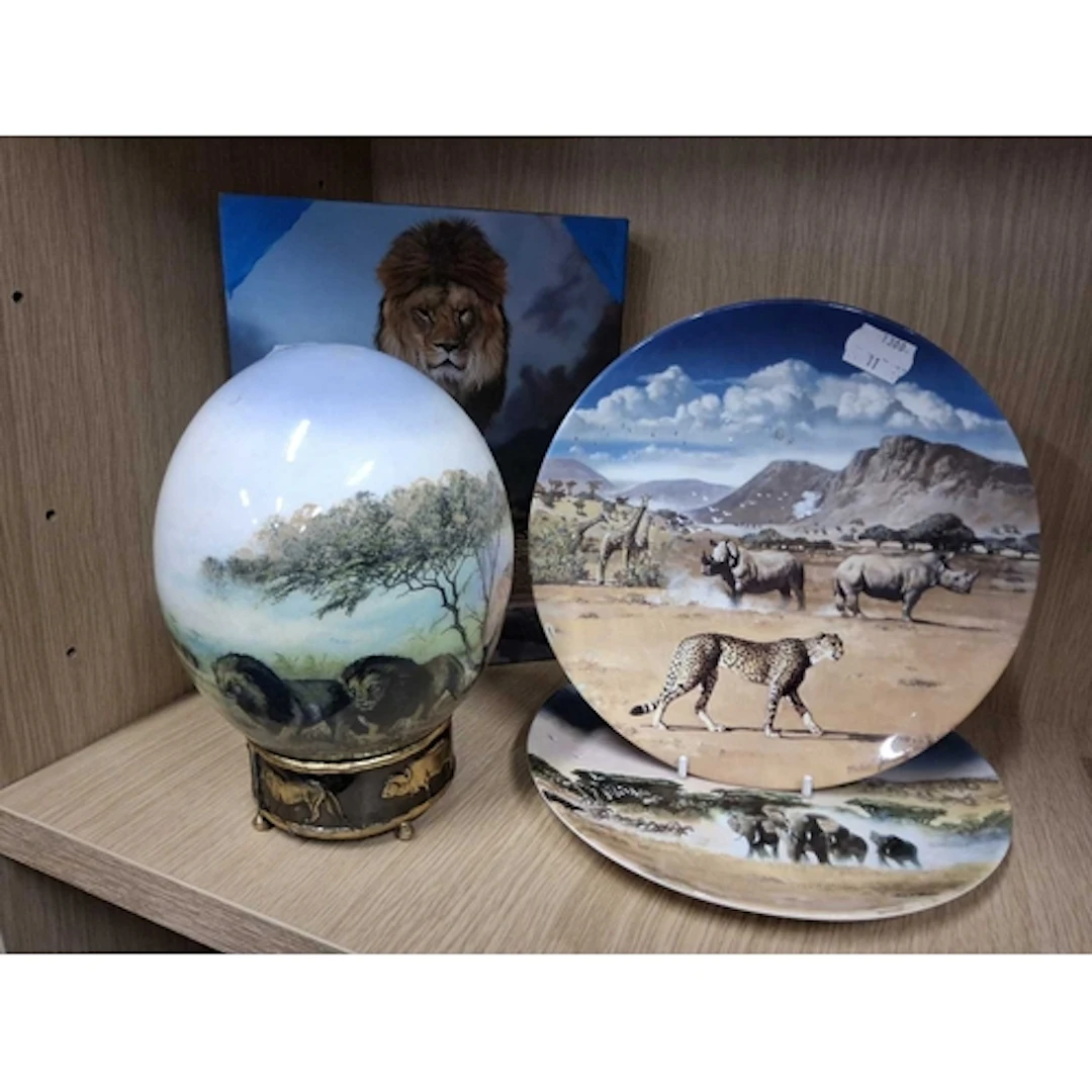 A GROUP OF AFRICAN WILDLIFE THEMED ITEMS, comprising an ostr...