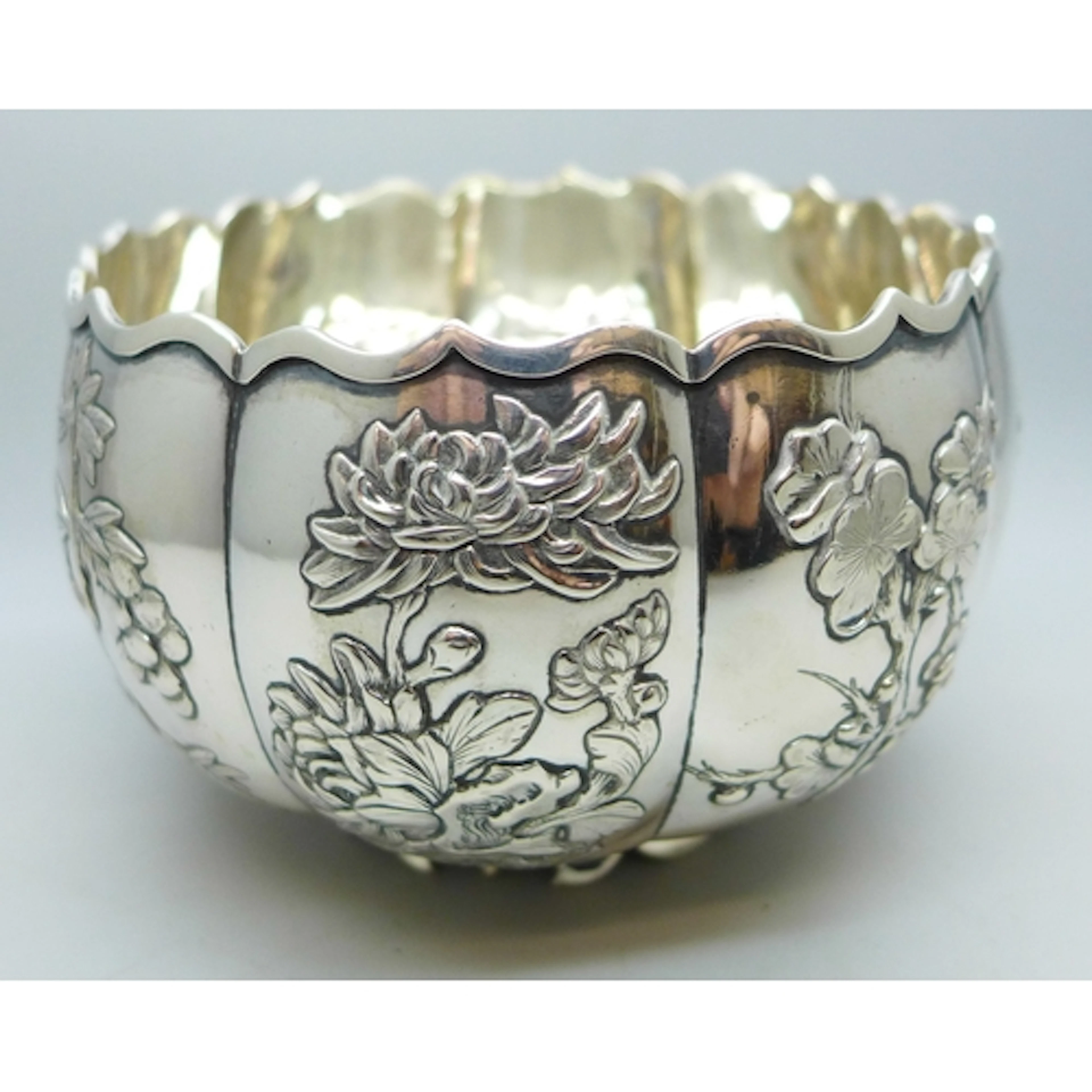 A Chinese .900 silver bowl with raised floral decoration, W...