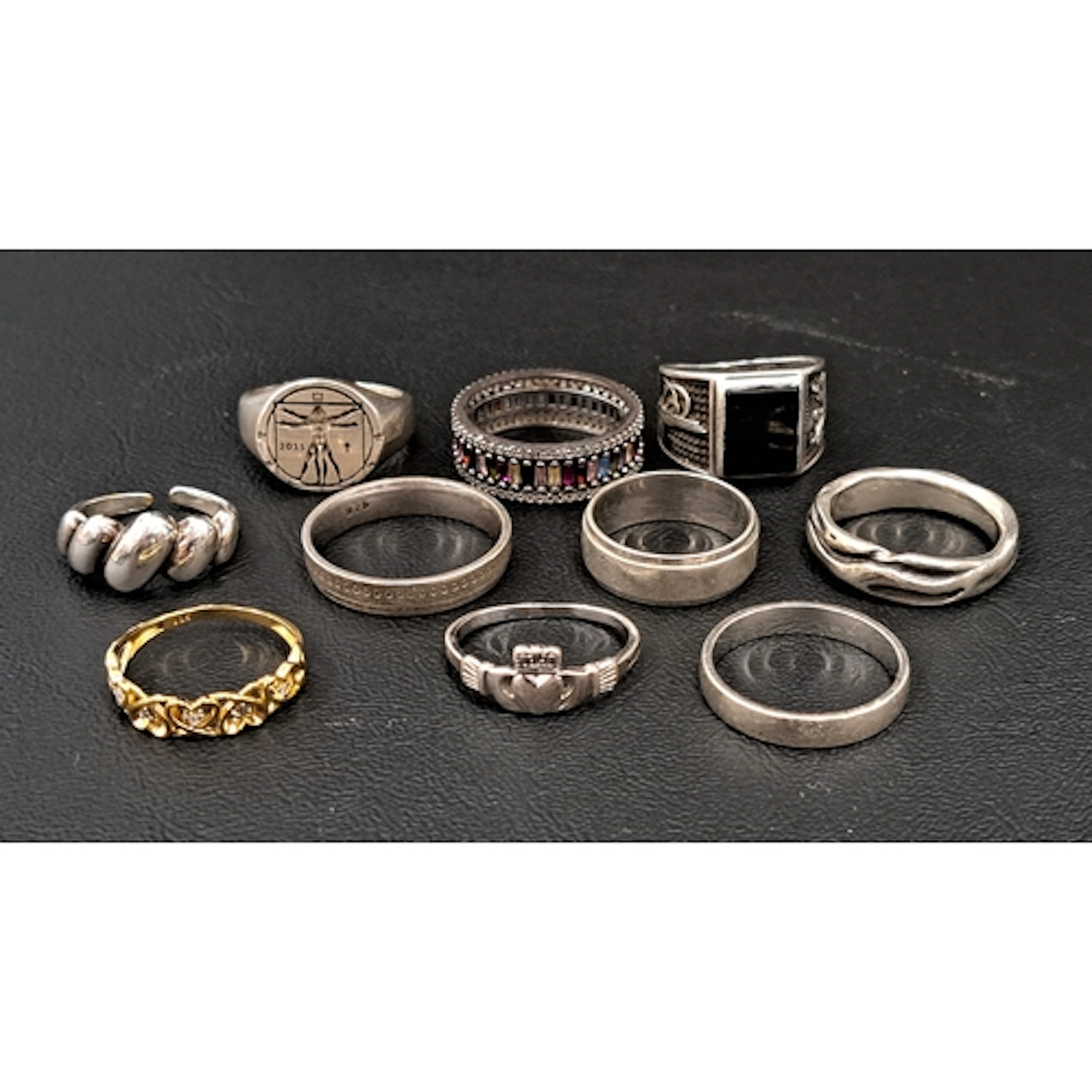 TEN SILVER RINGS including a seal ring with Vitruvian man st...