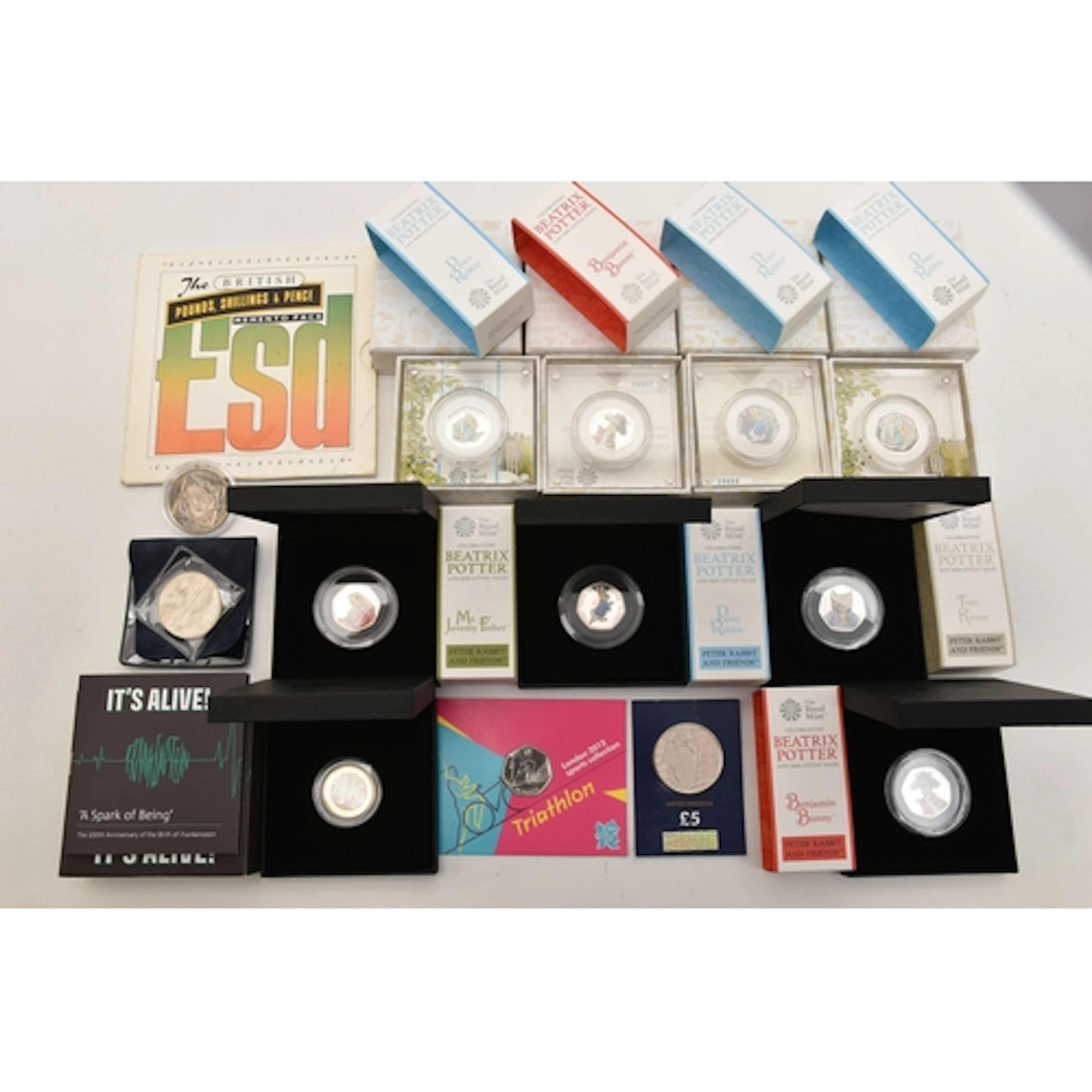 A CARDBOARD TRAY CONTAINING ROYAL MINT SILVER PROOF COINS, t...