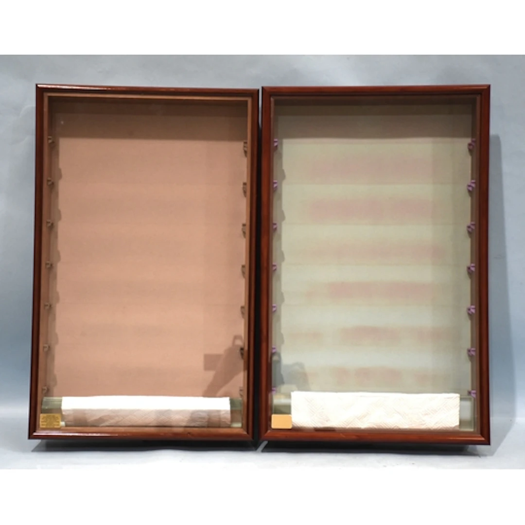 Two glazed wall display cases by Picture Pride, each with se...
