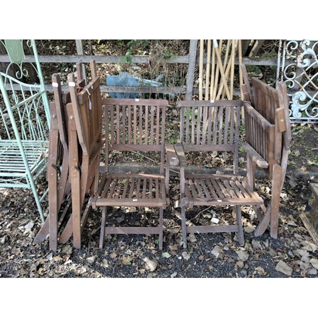 A SET OF FIVE FOLDING HARDWOOD GARDEN CHAIRS one chair dama...