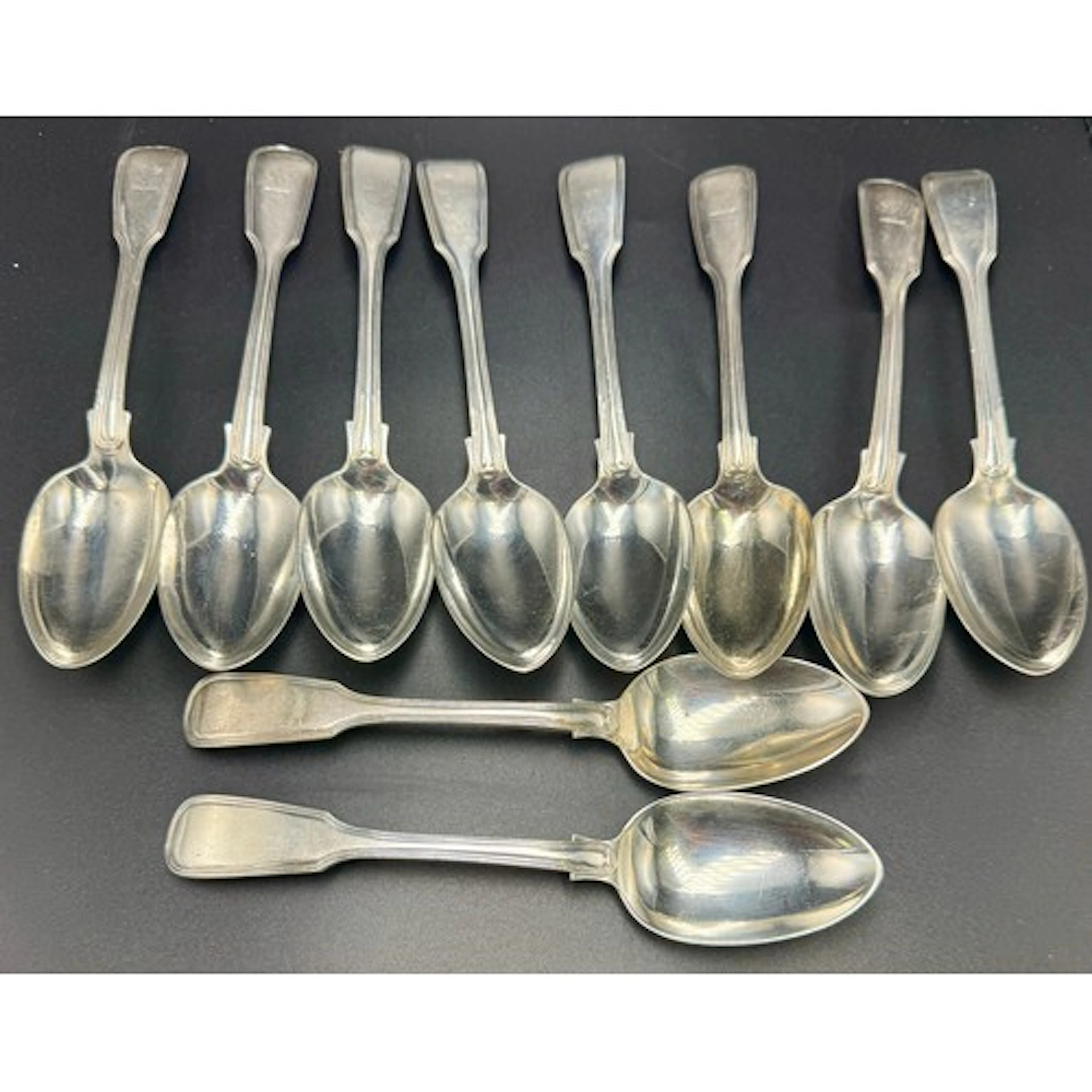 Ten Victorian silver fiddle and thread pattern dessert spoon...