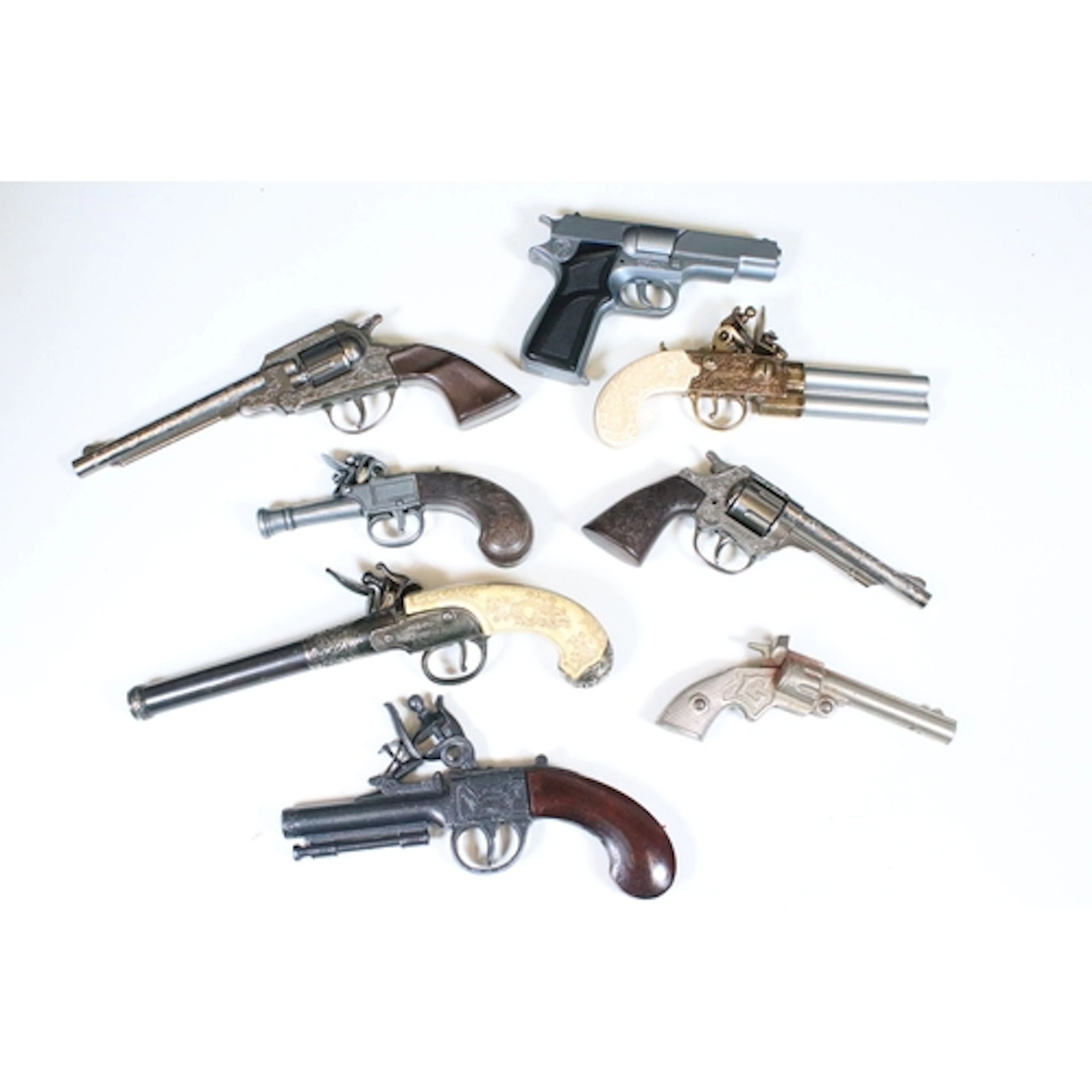 A small collection of vintage toy guns to include semi autom...
