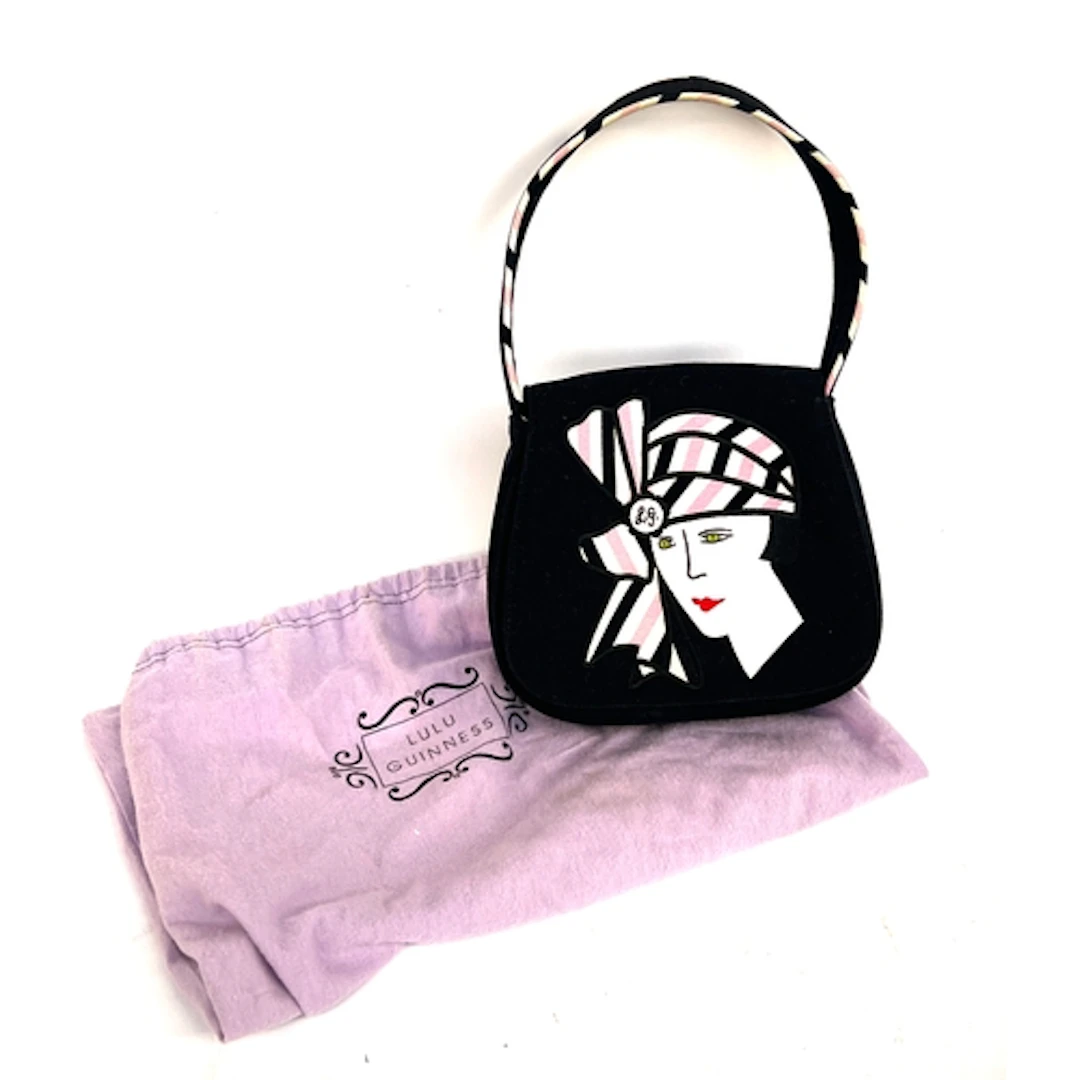 A Lulu Guinness black handbag with lady in a hat design, wit...