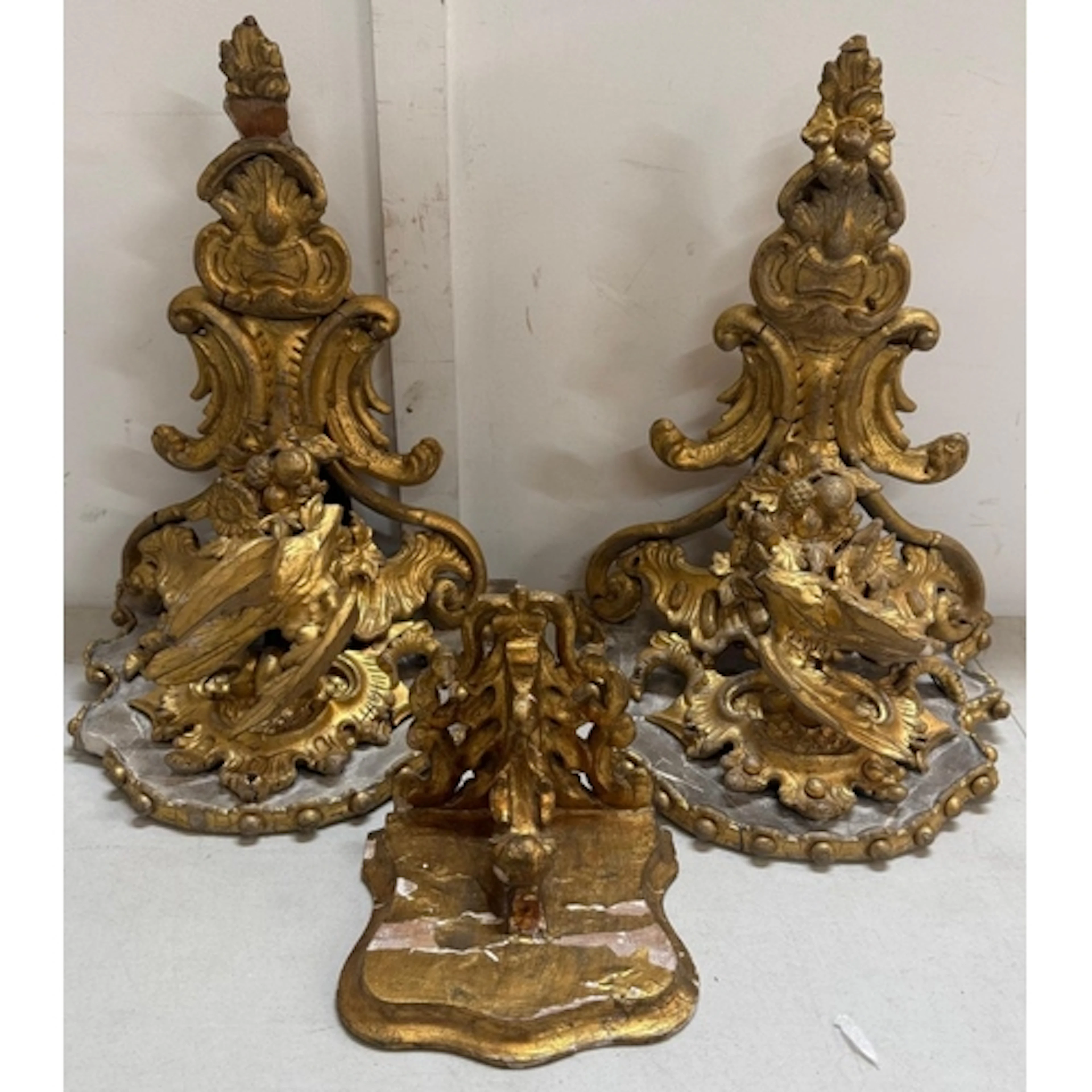 Three gilt wood sconces in the rococco style.