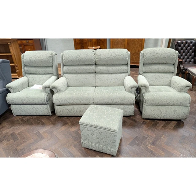 A Sherborne two seater settee three piece suite in green emb...