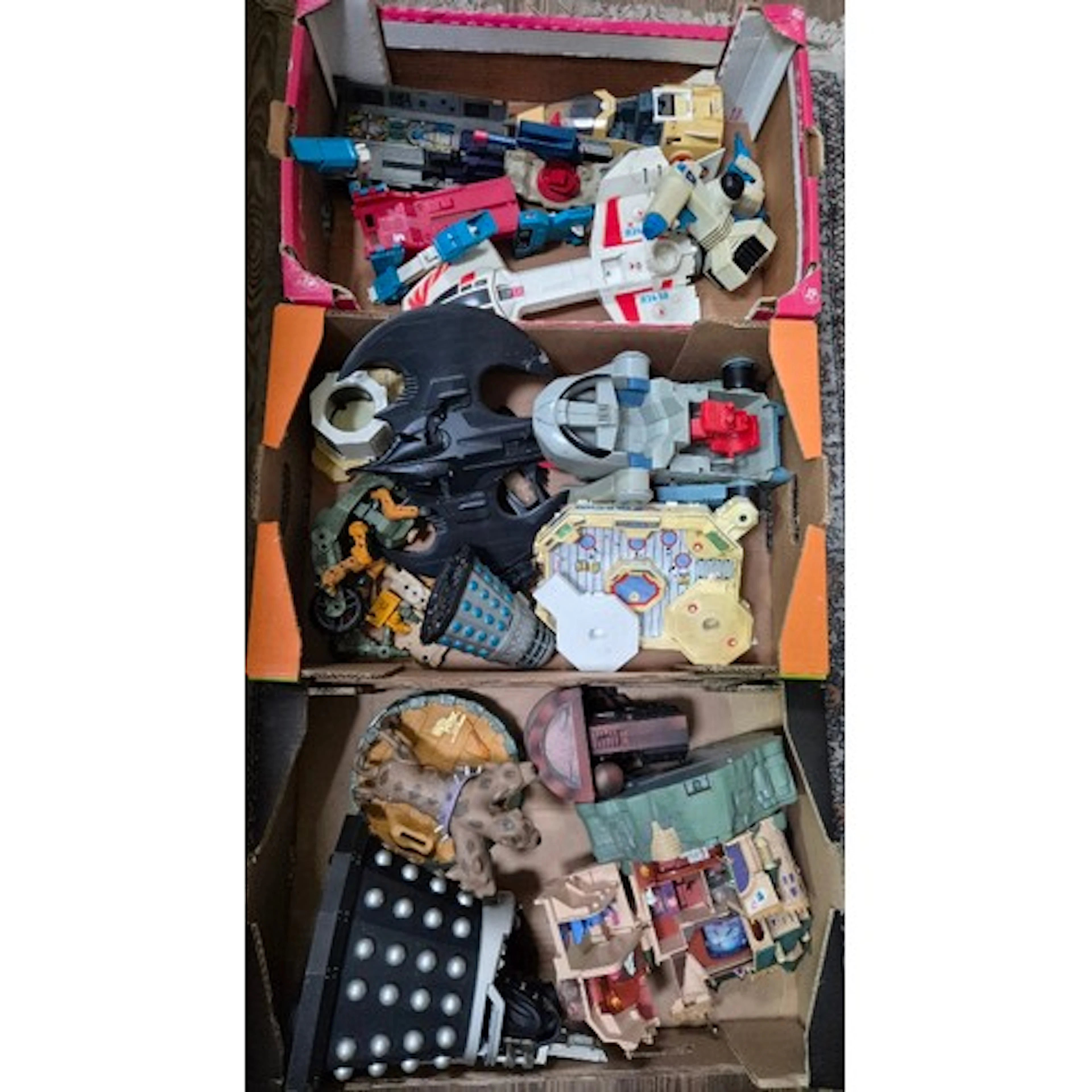 Three boxes of assorted vintage toys.