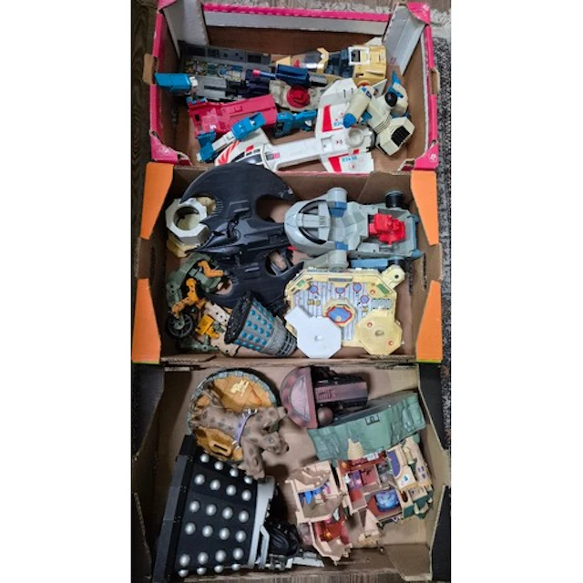 Three boxes of assorted vintage toys.