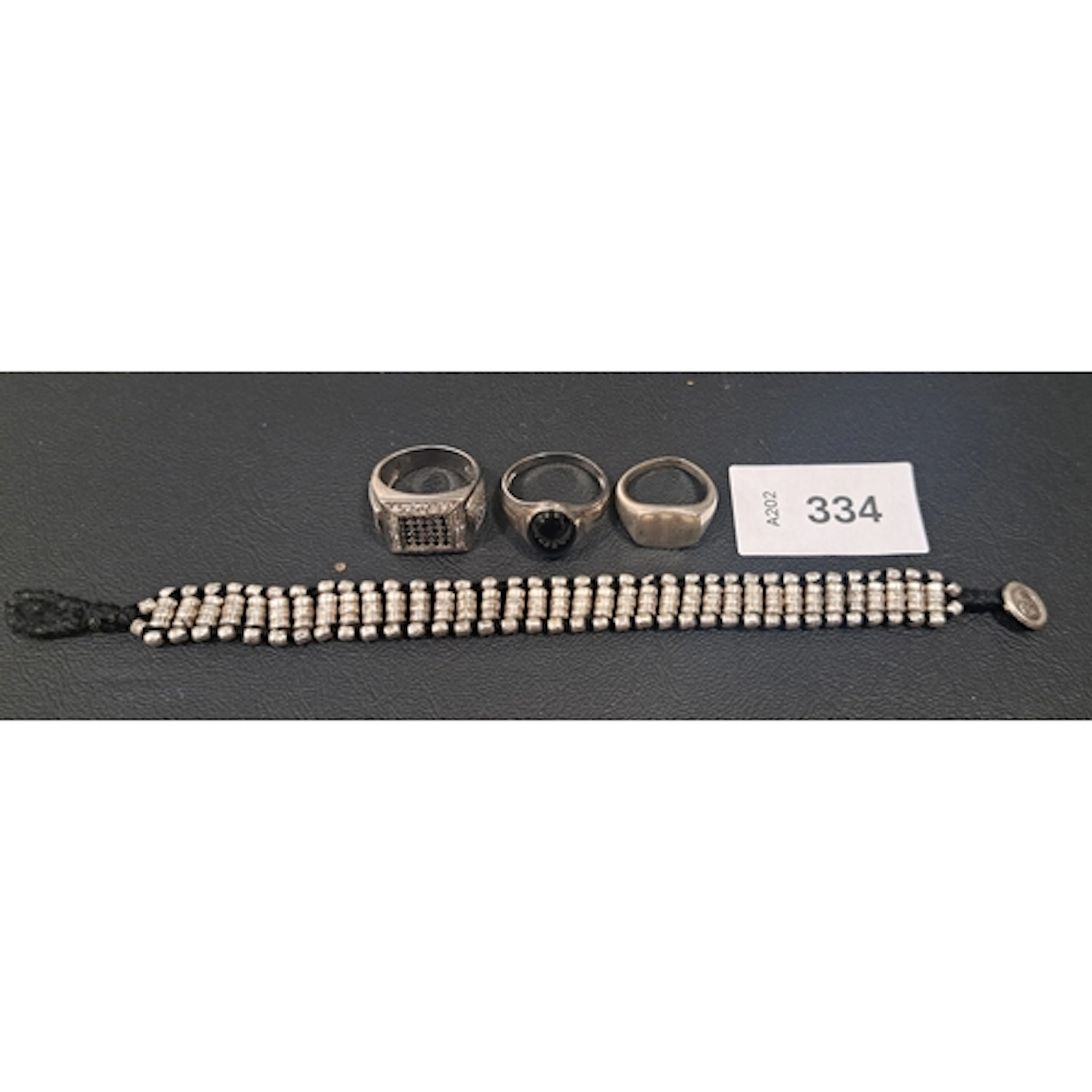 FOUR ITEMS OF SILVER/SILVER MOUNTED JEWELLERY comprising a ...