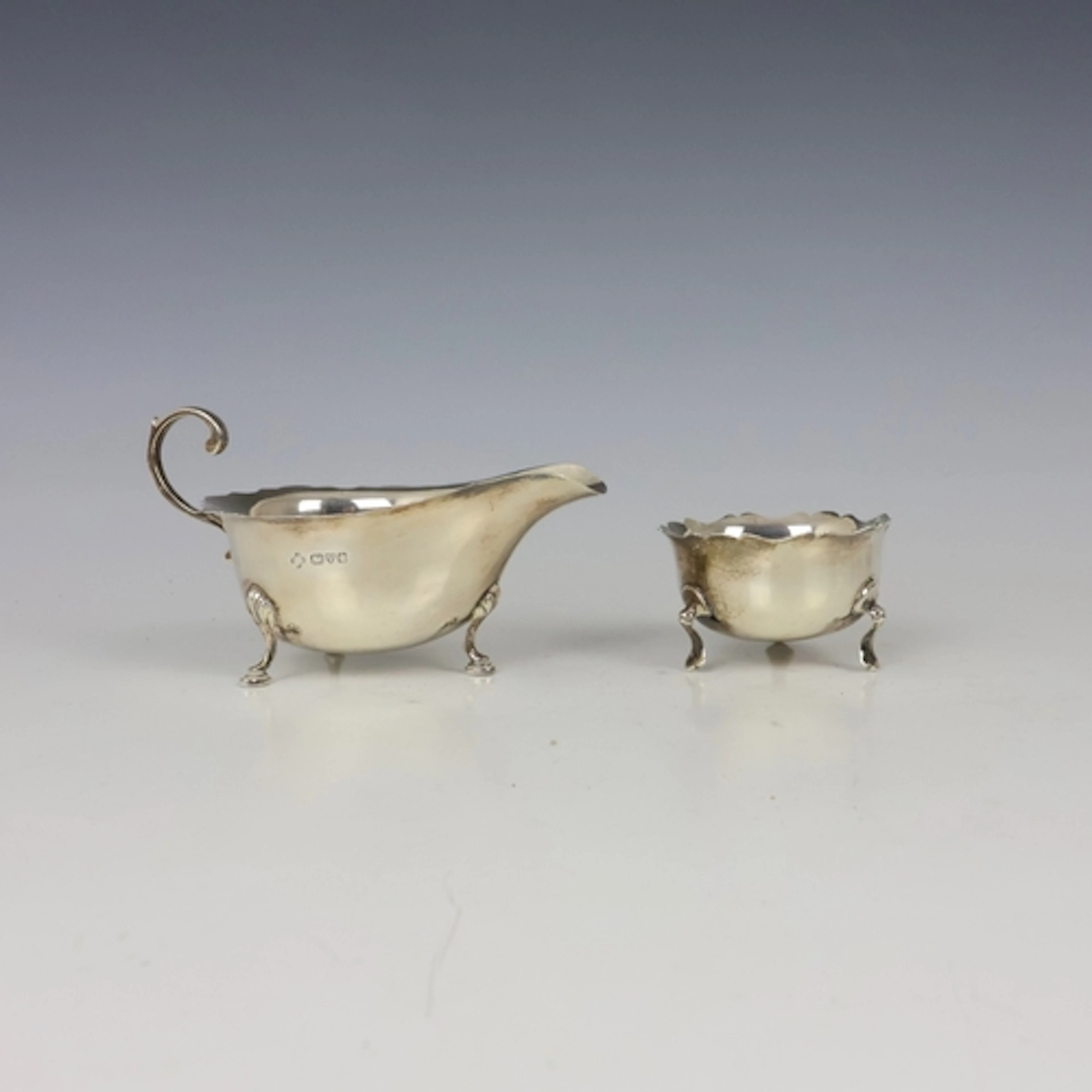 A George V silver sauce boat, Chester 1928, the shaped rim a...