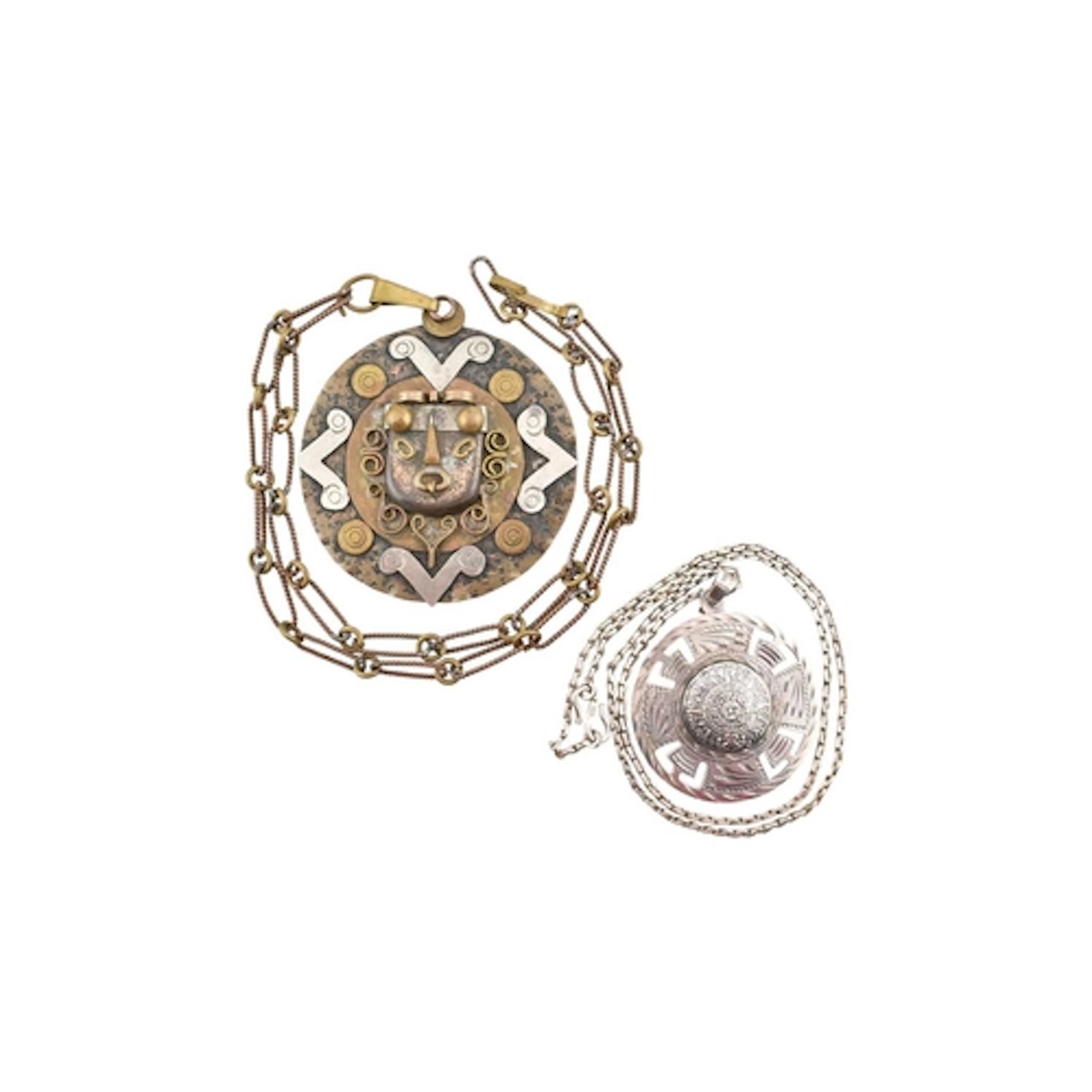 A silver Mexican Aztec calendar pendant and chain. The chain...