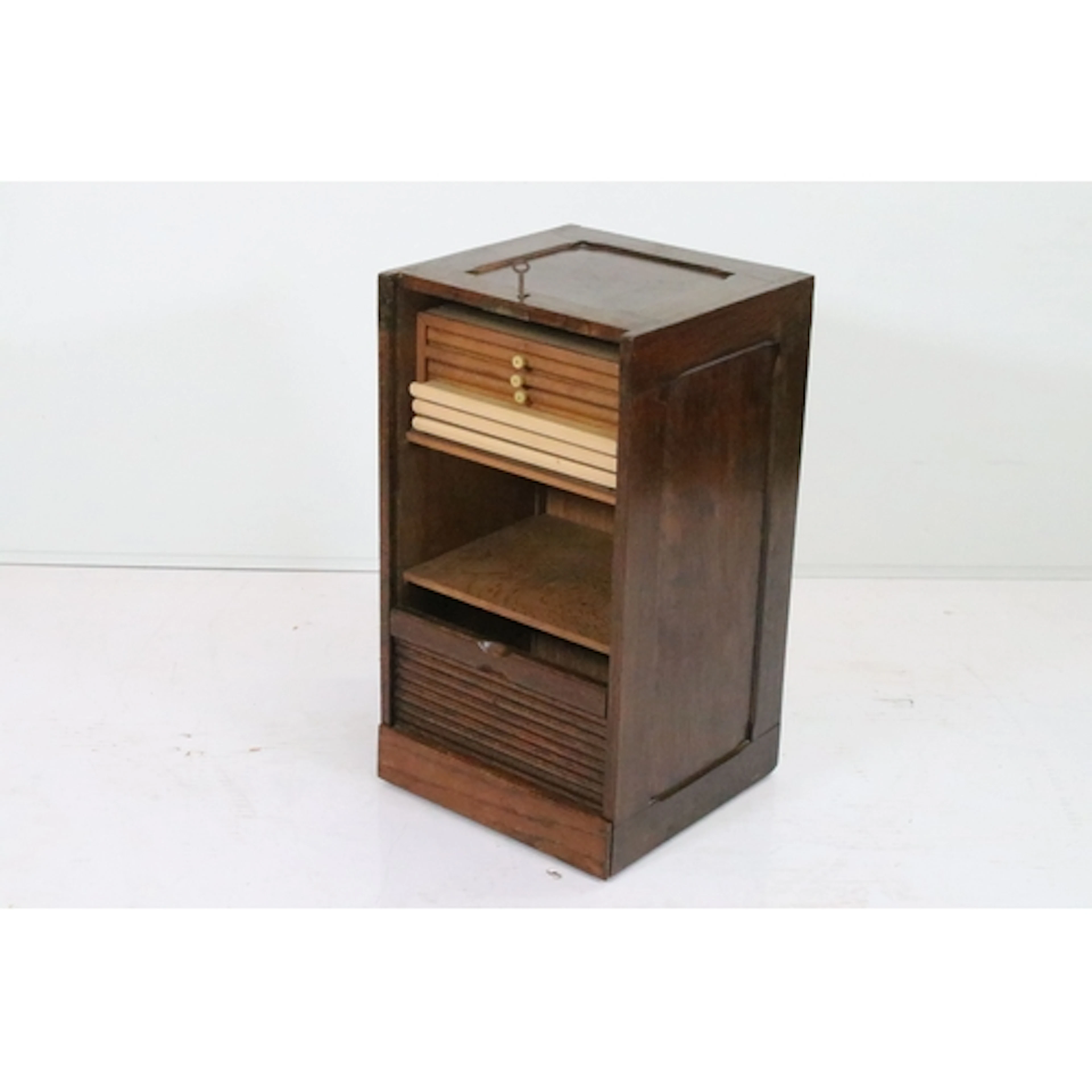 Early 20th century oak tambour fronted cabinet, having a par...