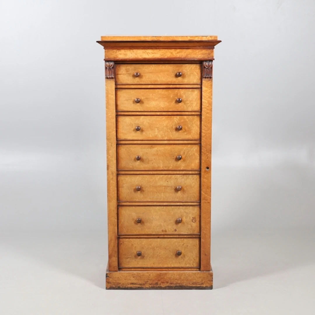 A VICTORIAN BIRDS EYE MAPLE WELLINGTON CHEST. fitted with se...