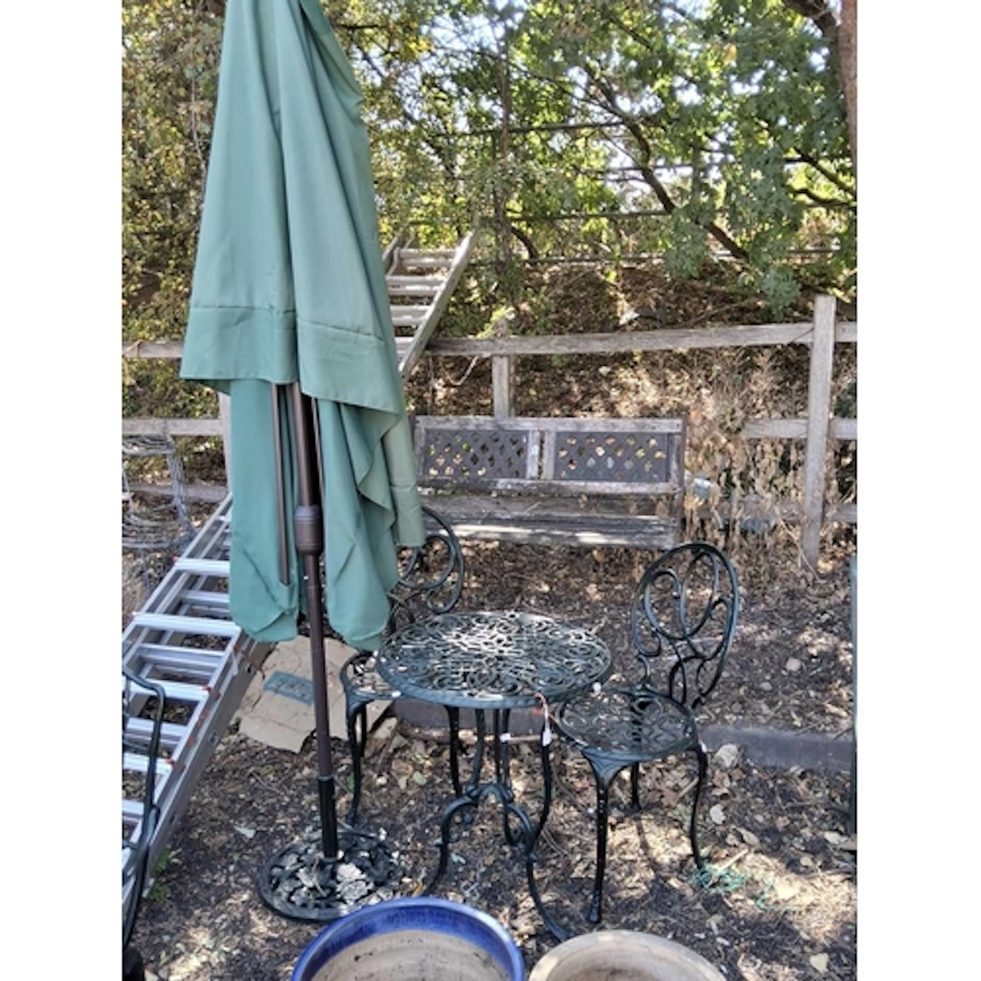 A MODERN CAST ALUMINIUM CIRCULAR GARDEN TABLE, two matching ...