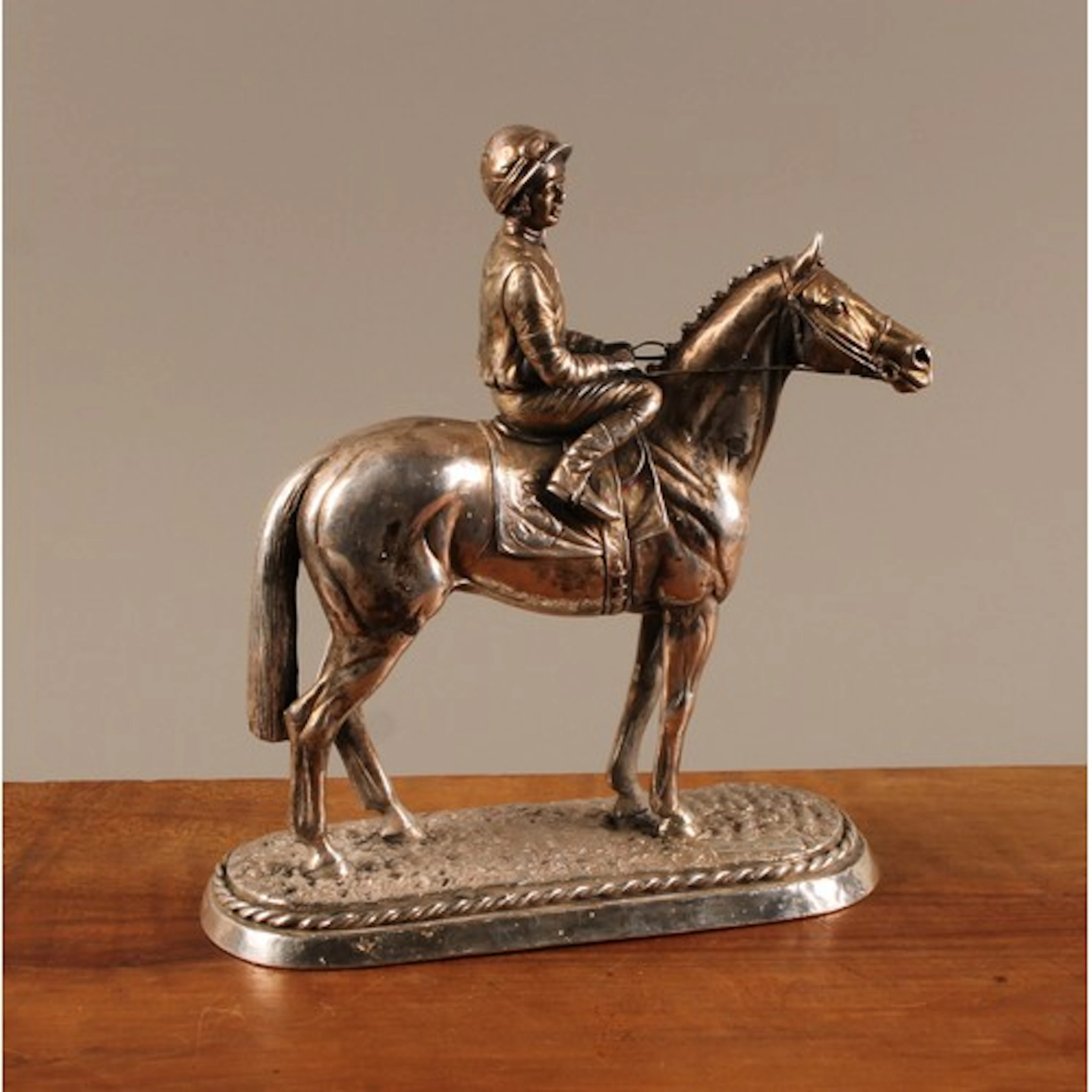 An Elizabeth II filled silver model of a horse and jockey, 2...