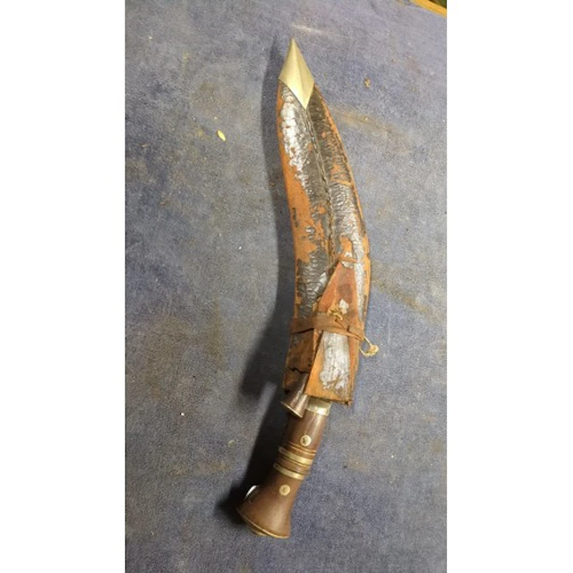 Nepalese kukri with curved steel blade and notched ricasso, ...