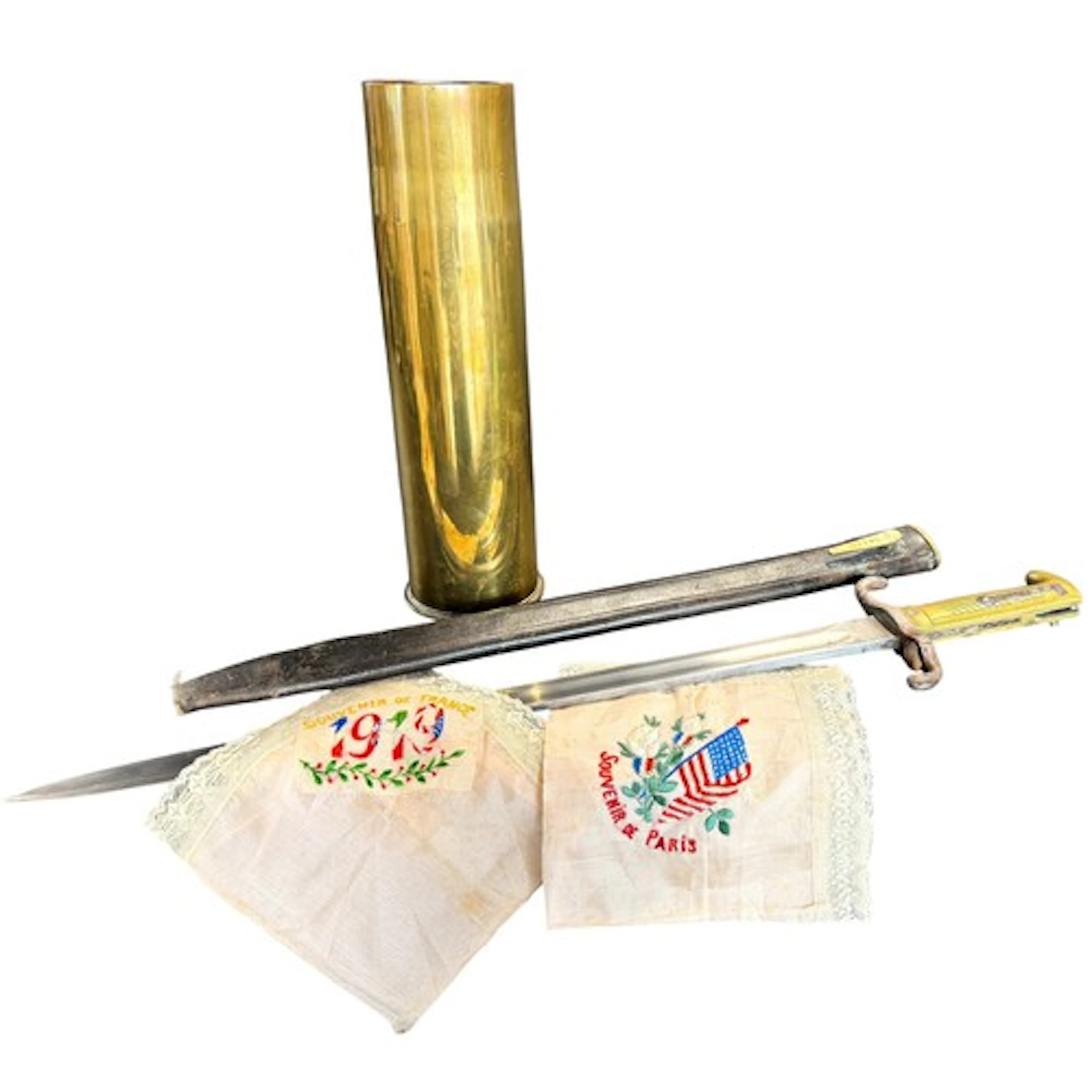 Military interest; a brass shell case, German bayonet and a ...