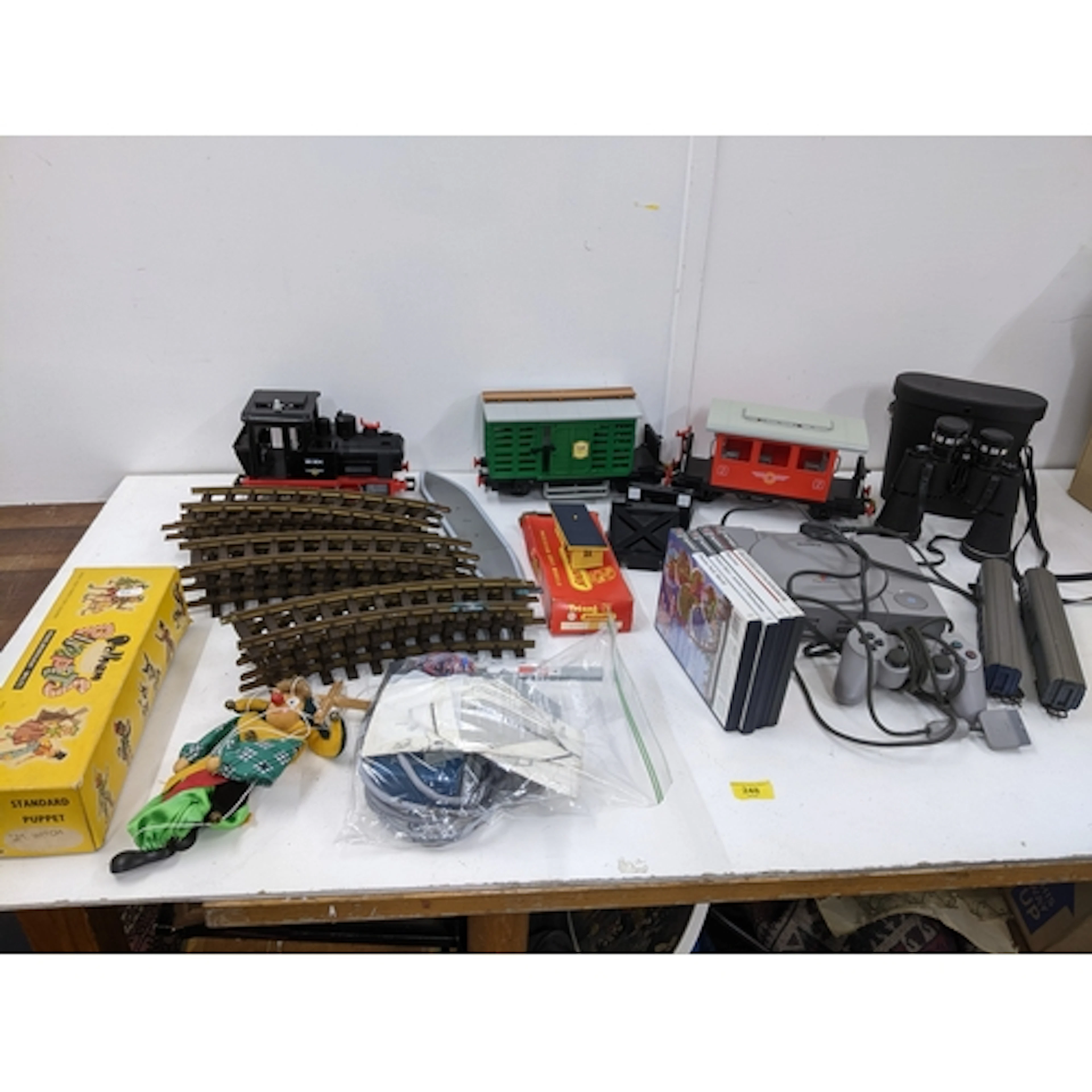 A mixed group of toys to include a Playmobil train set, a bo...