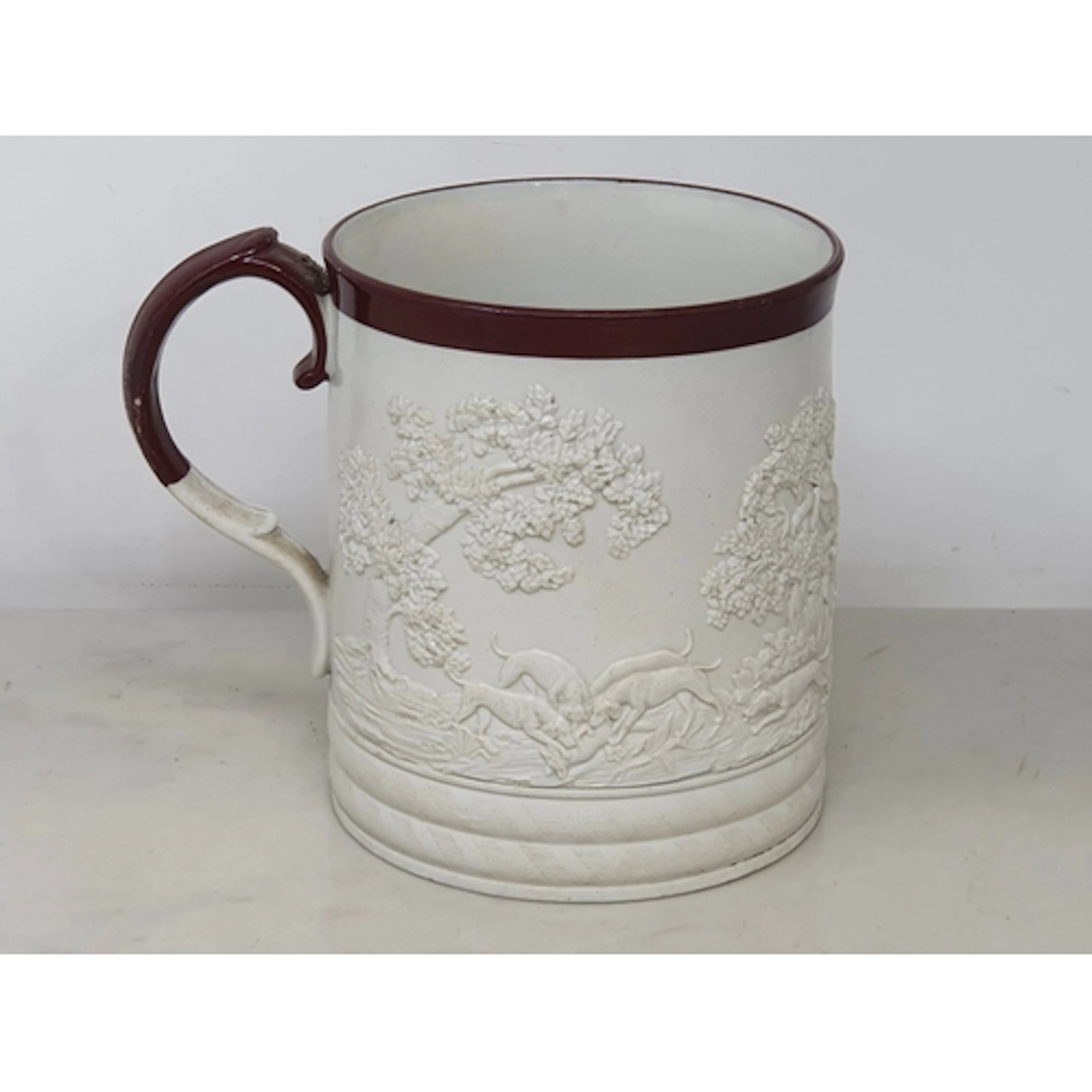A 19th century Davenport stoneware Mug decorated hunting sce...