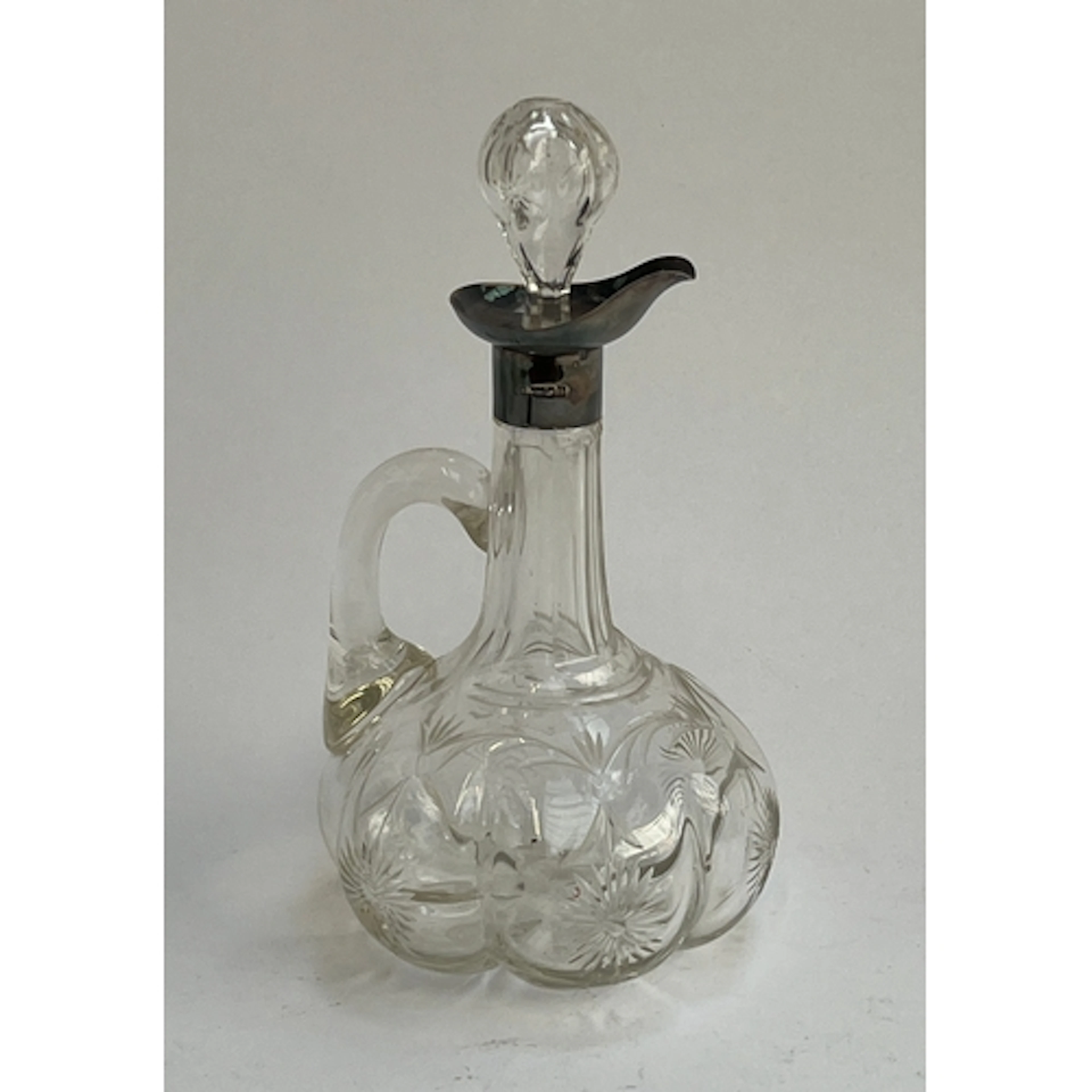 A Dutch handblown and etched decanter depicting windmills an...