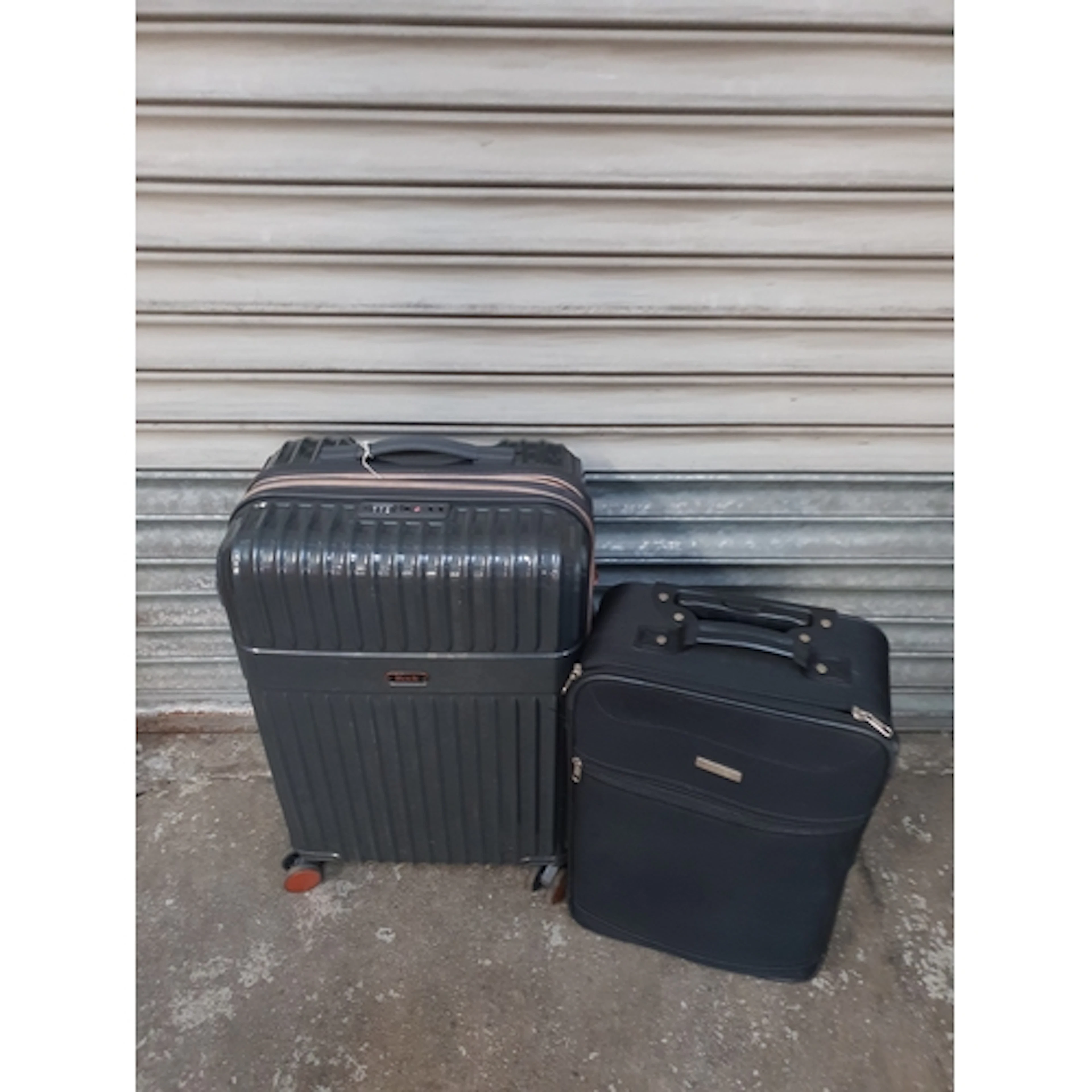 TWO SUITCASES including Rock Note: cases and bags are empty