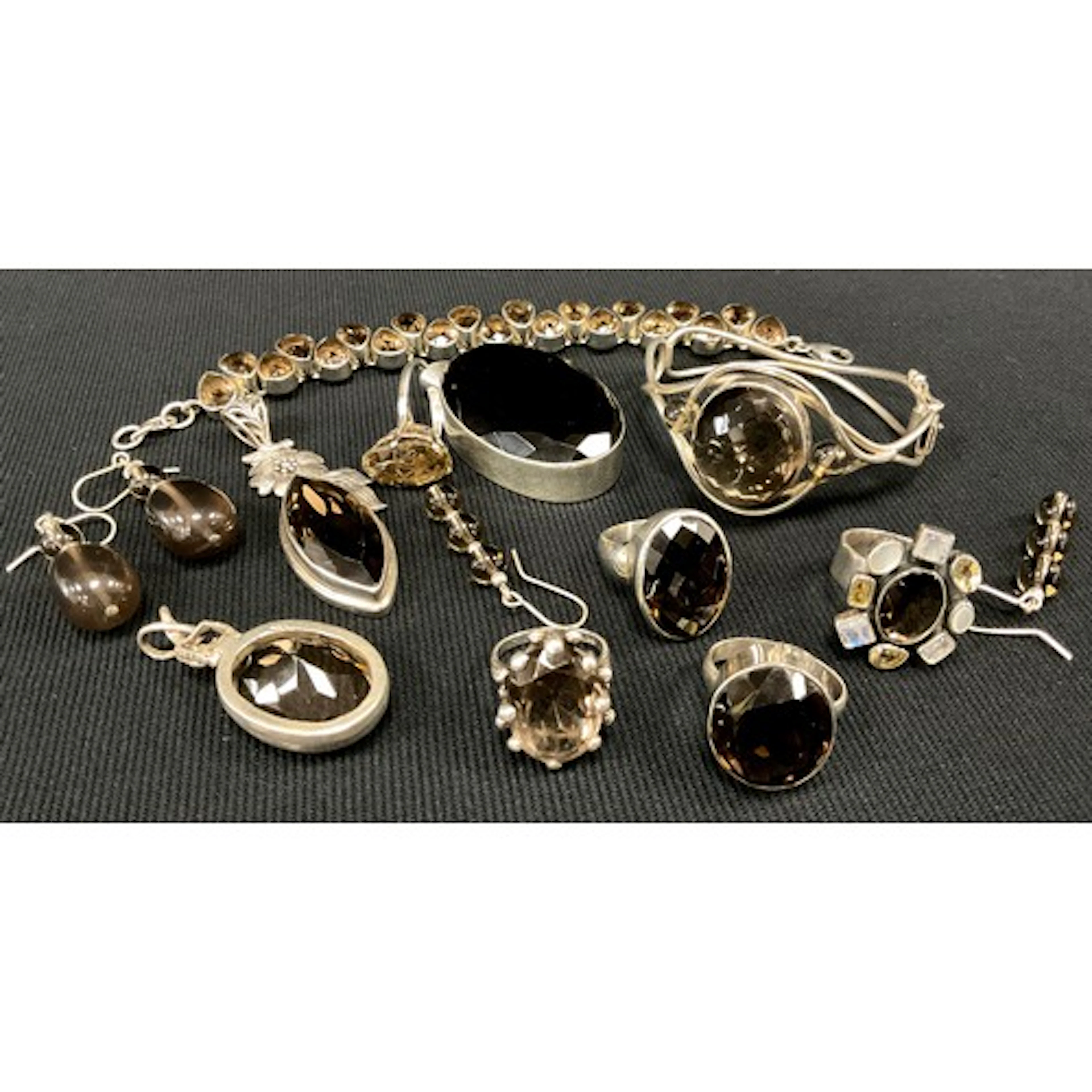 An Articulated smoky quartz bracelet with pear drop stones, ...