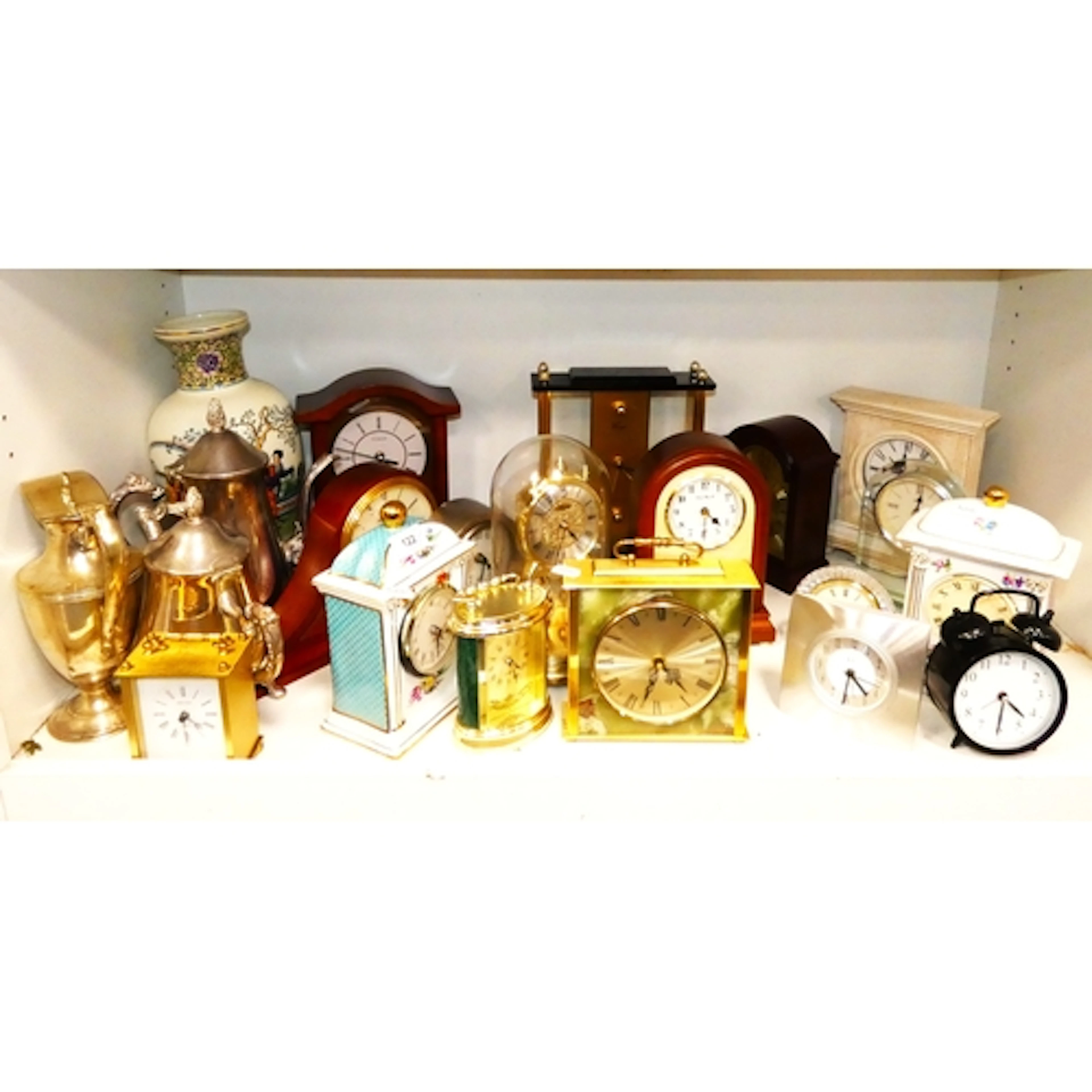 Shelf of modern clocks to include mantel and carriage clocks...