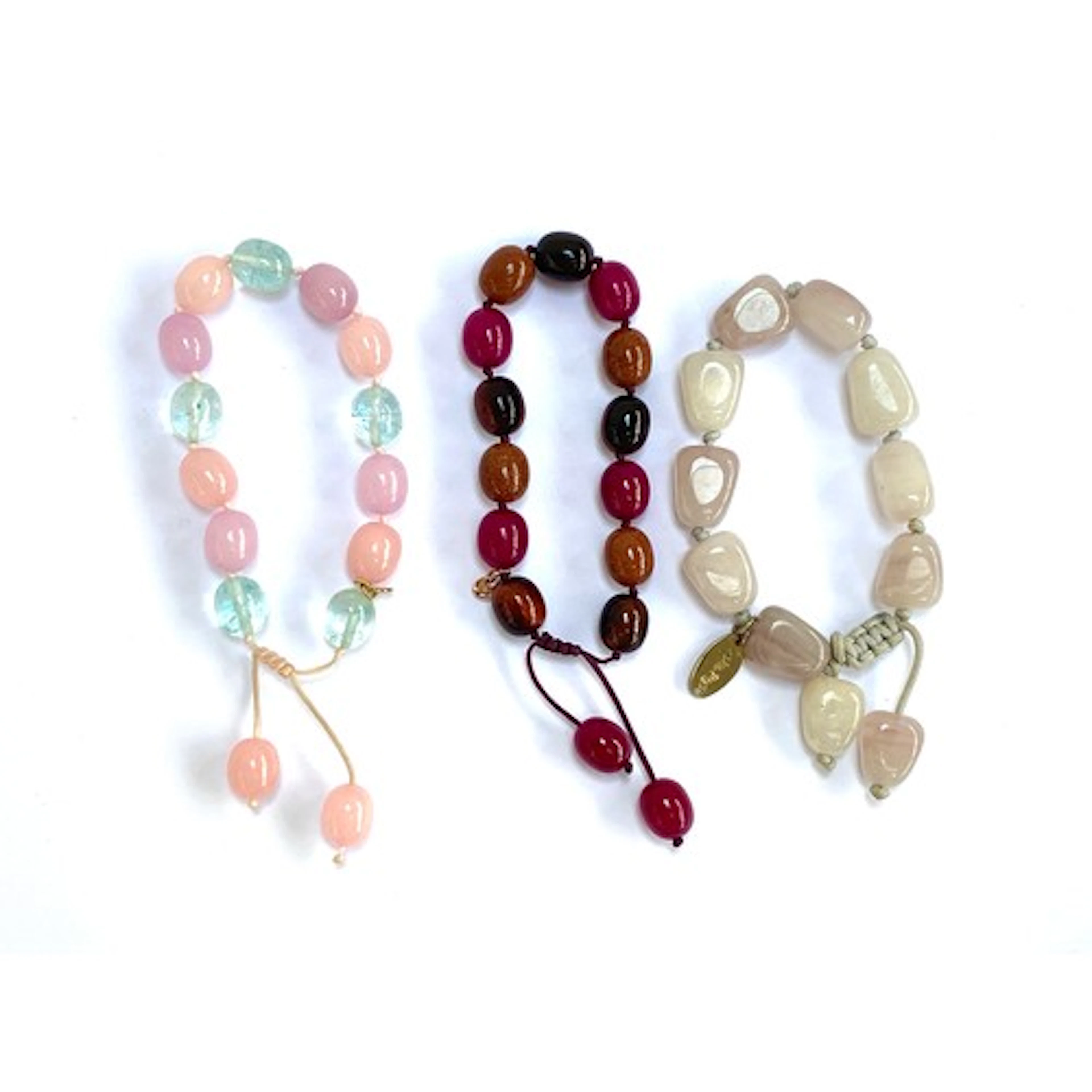 Three Lola Rose beaded bracelets, two with pink and blue ag...