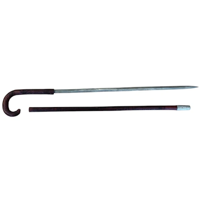Somali stick swords, dark red leather, crook style handle, a...