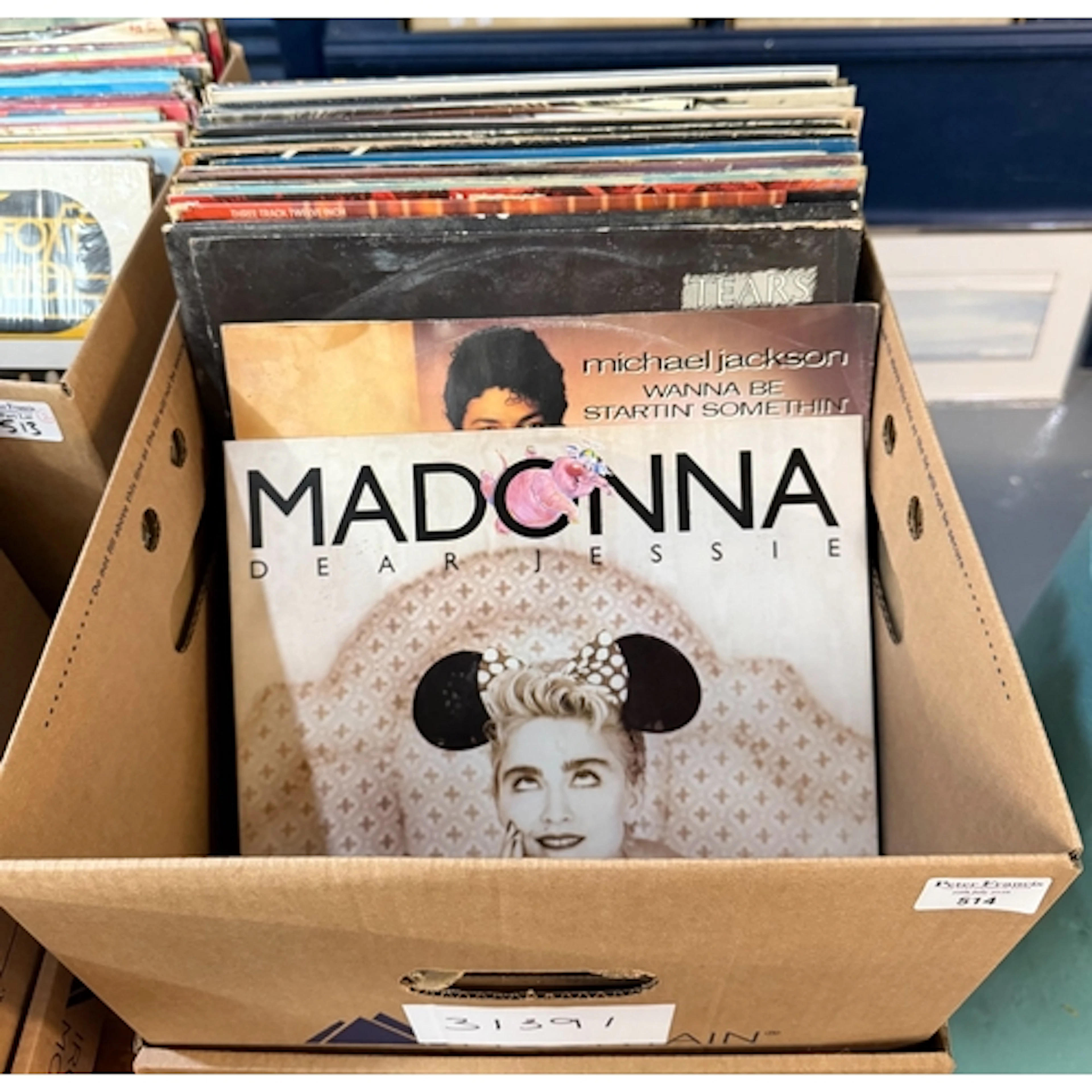 Box of assorted vinyl LP records to include: Madonna, Michae...