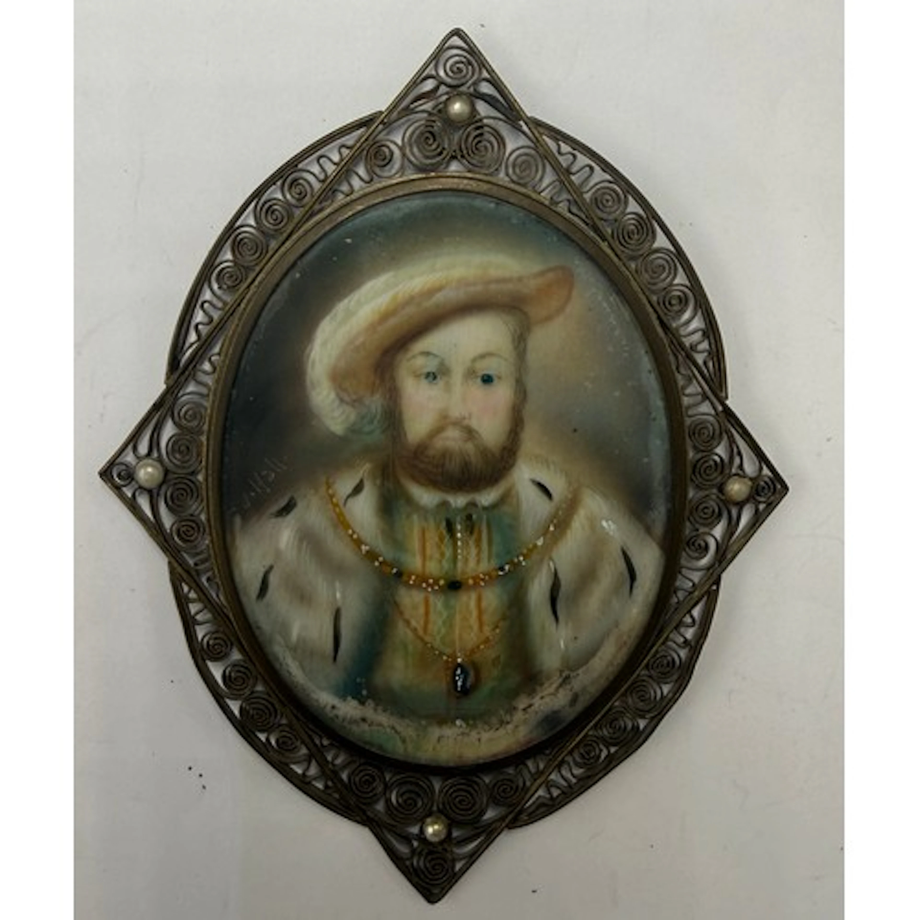 A miniature painting on ivory depicting Henry VIII within a ...